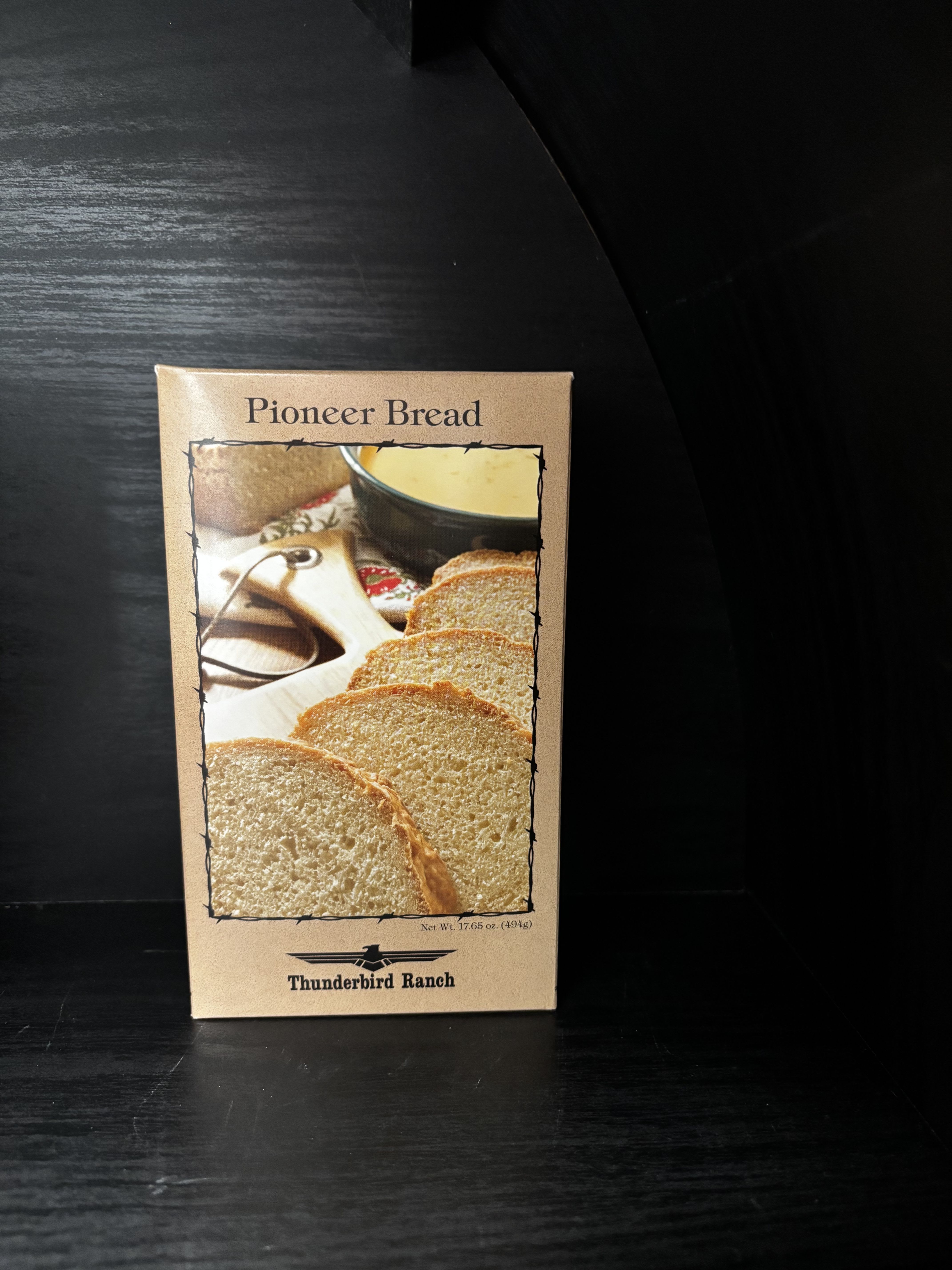 Box of Pioneer Bread mix on a dark shelf