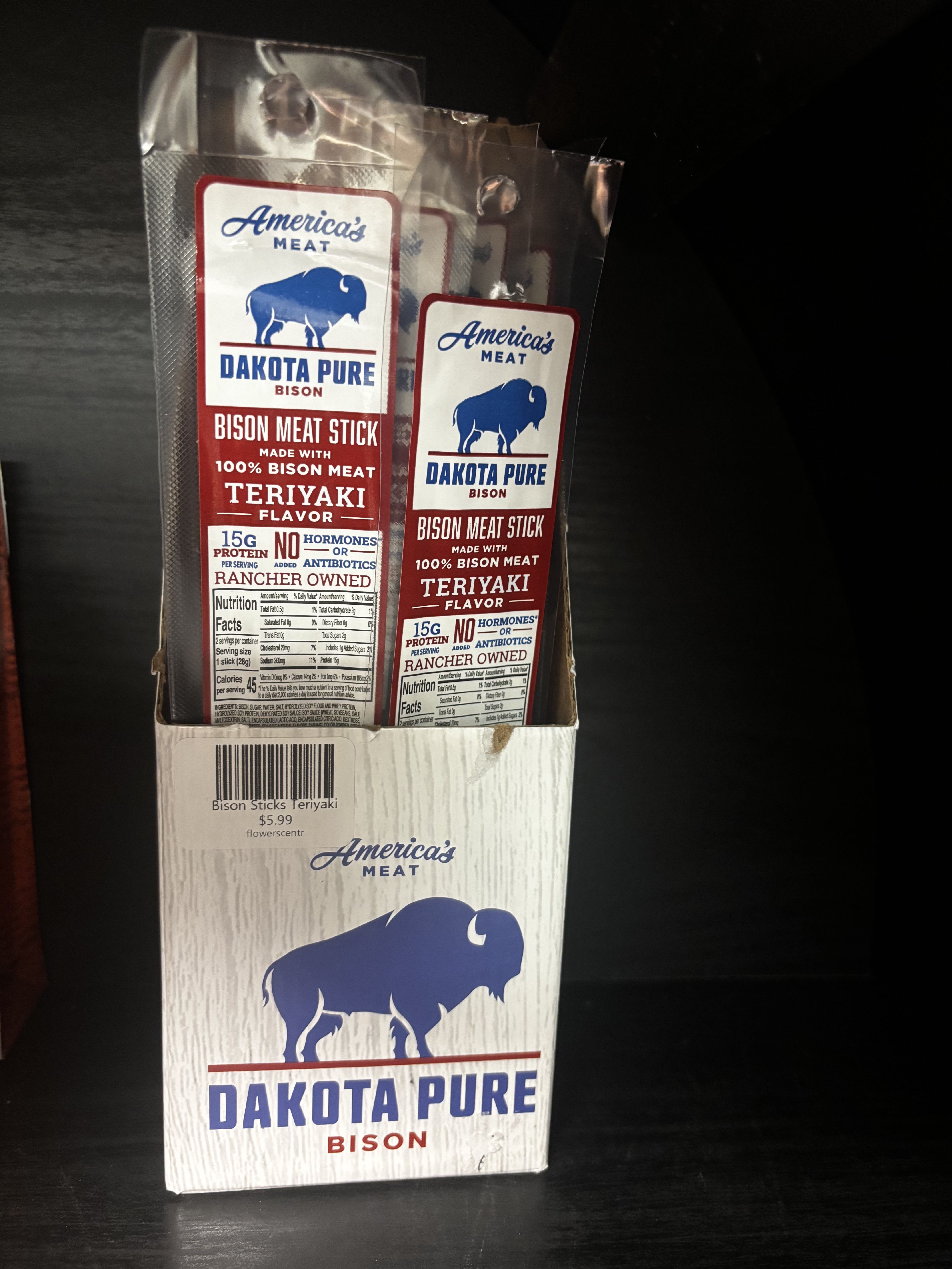 Box of Dakota Pure bison meat sticks in clear plastic packs