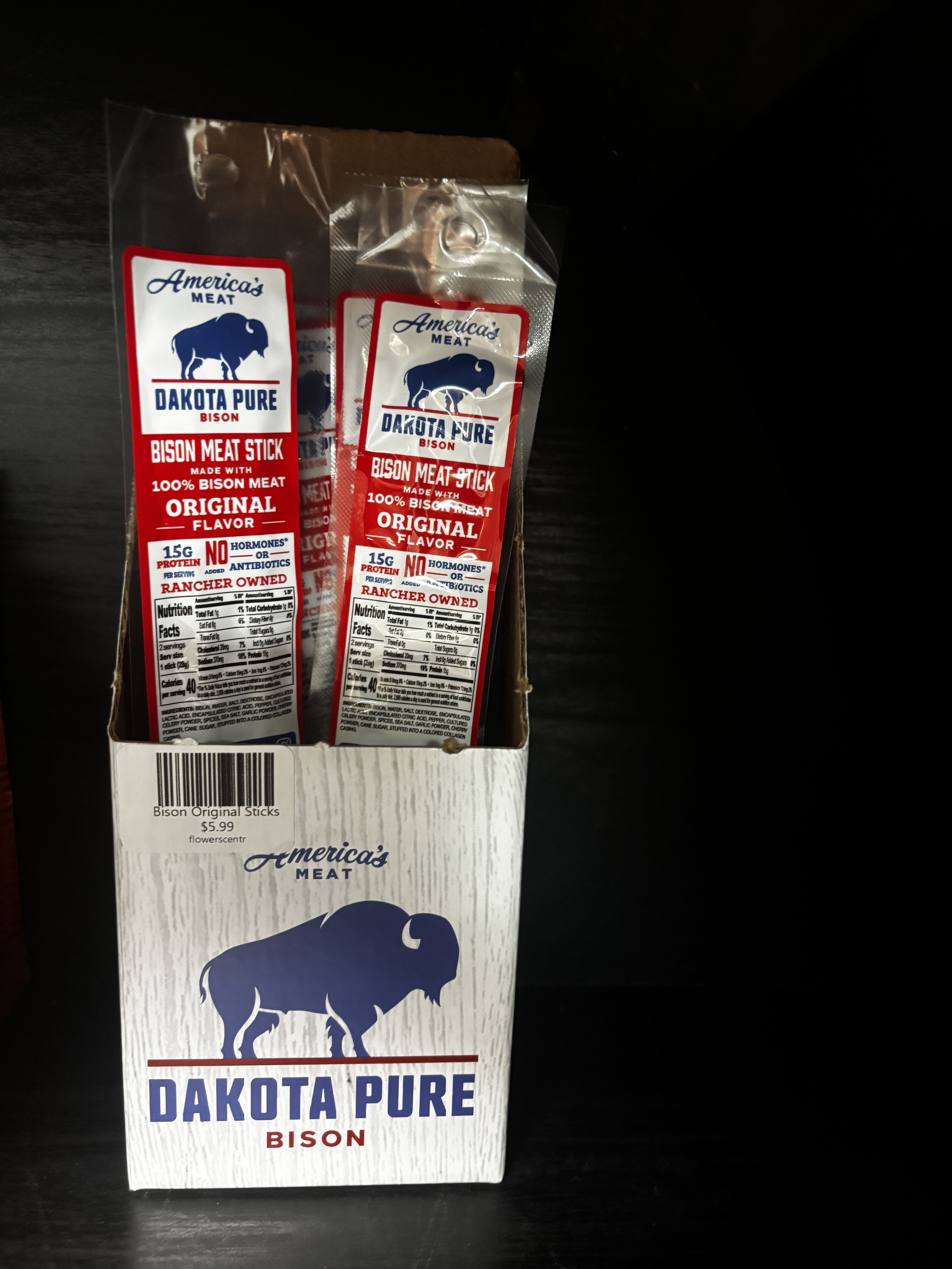 Box of Dakota Pure bison meat sticks in red and white packaging