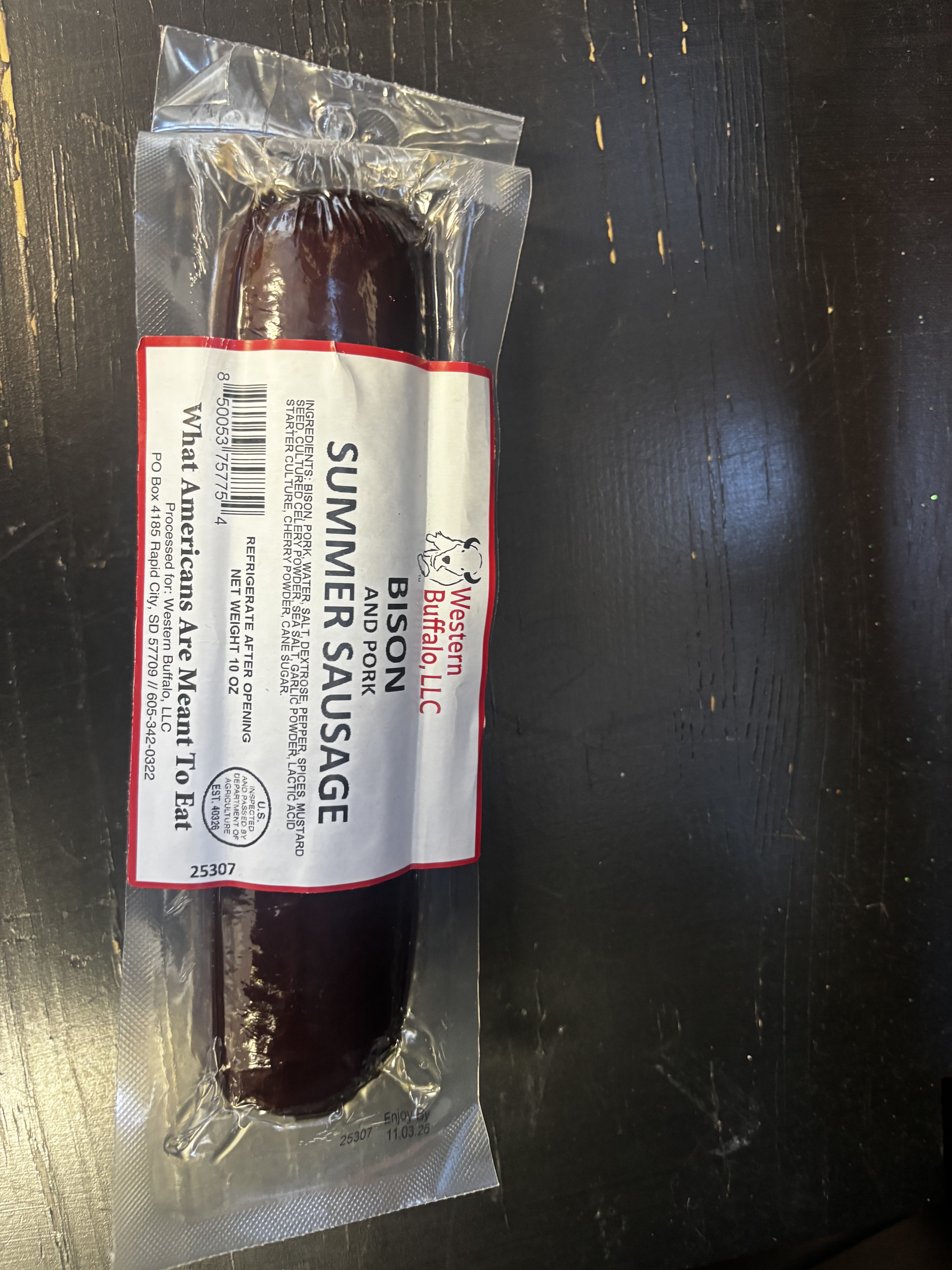 Packaged bison and pork summer sausage in clear plastic wrap