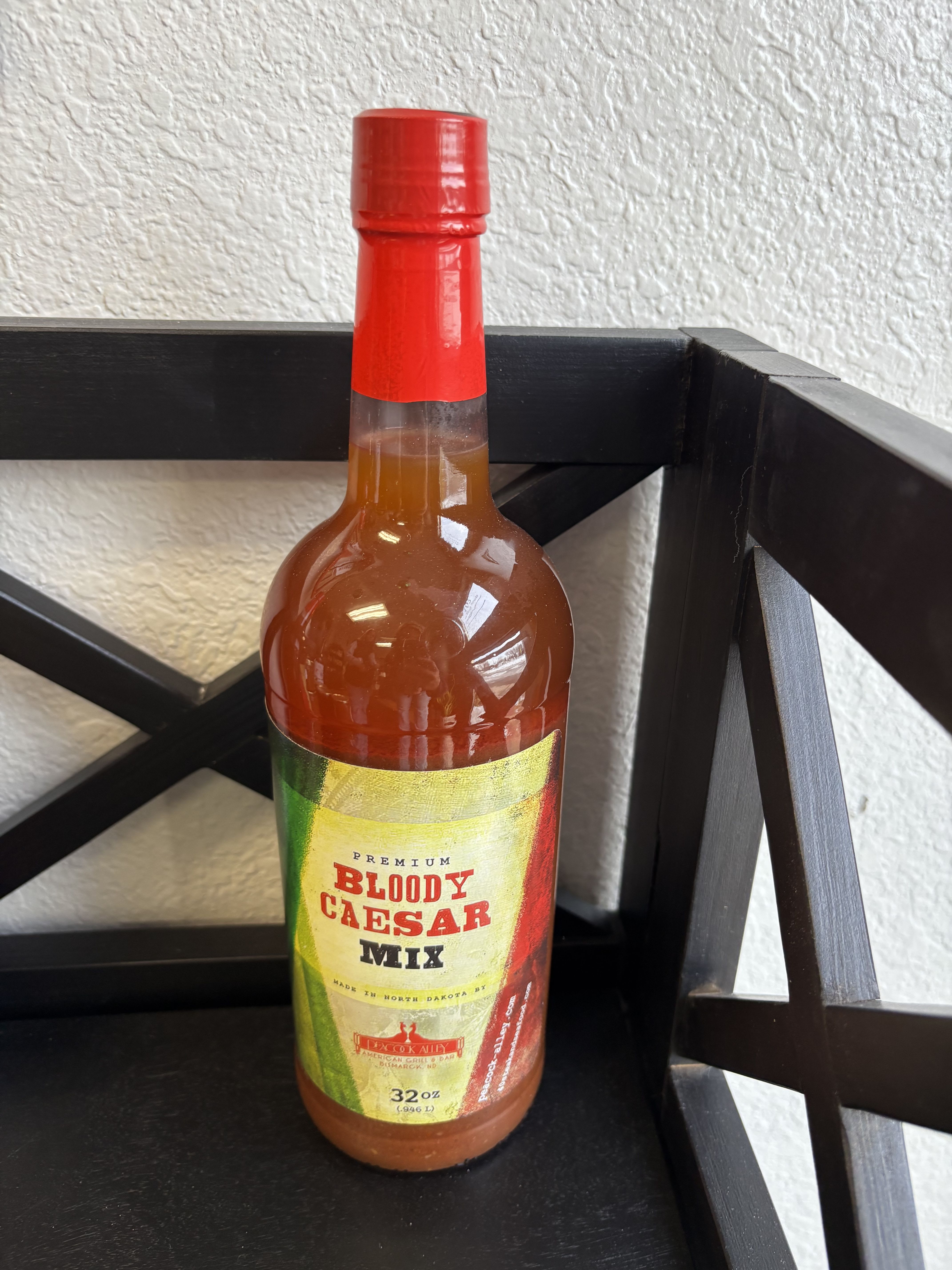 Bottle of Bloody Caesar mix with a red cap