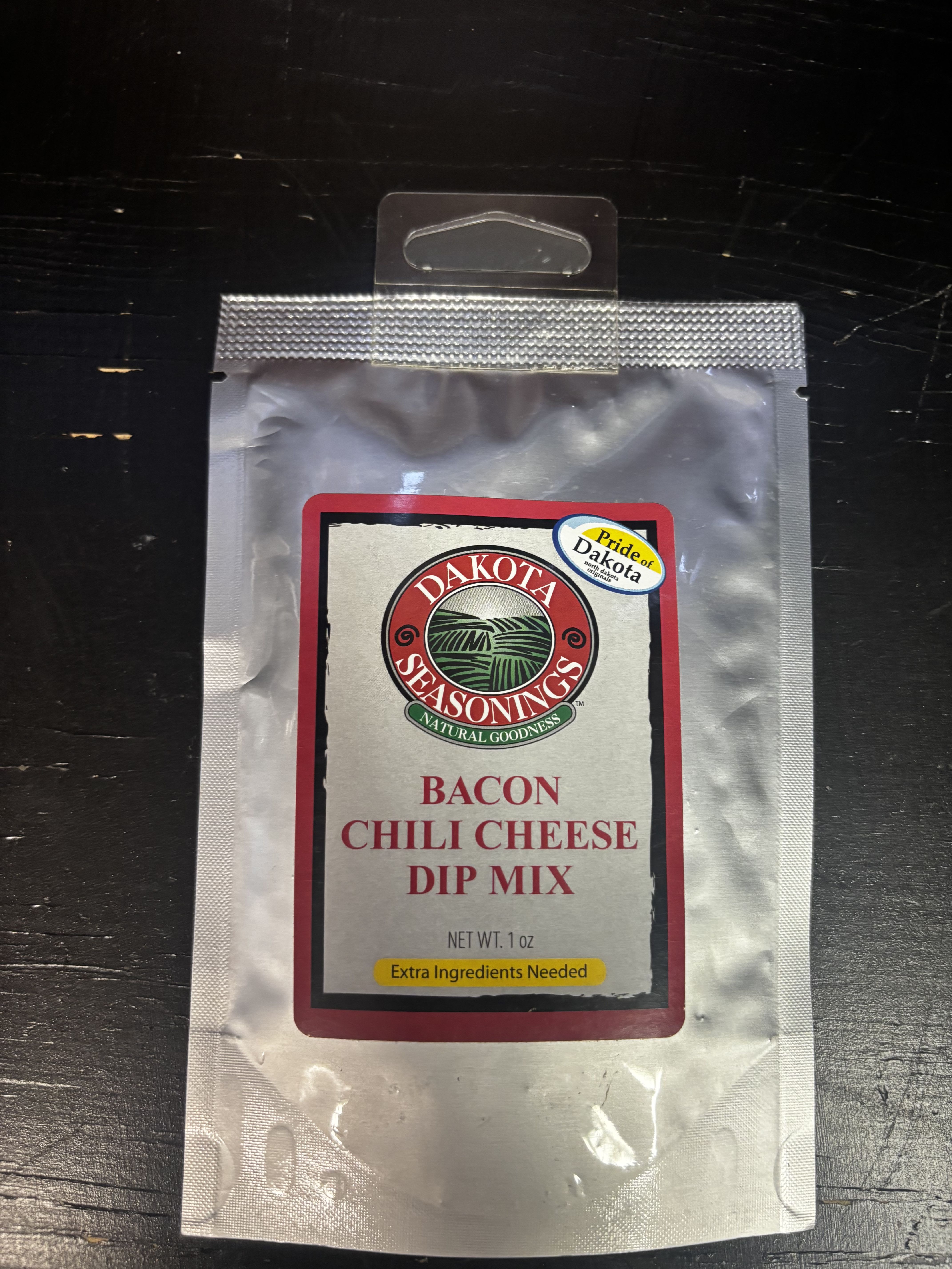 Packet of bacon chili cheese dip mix in a silver pouch