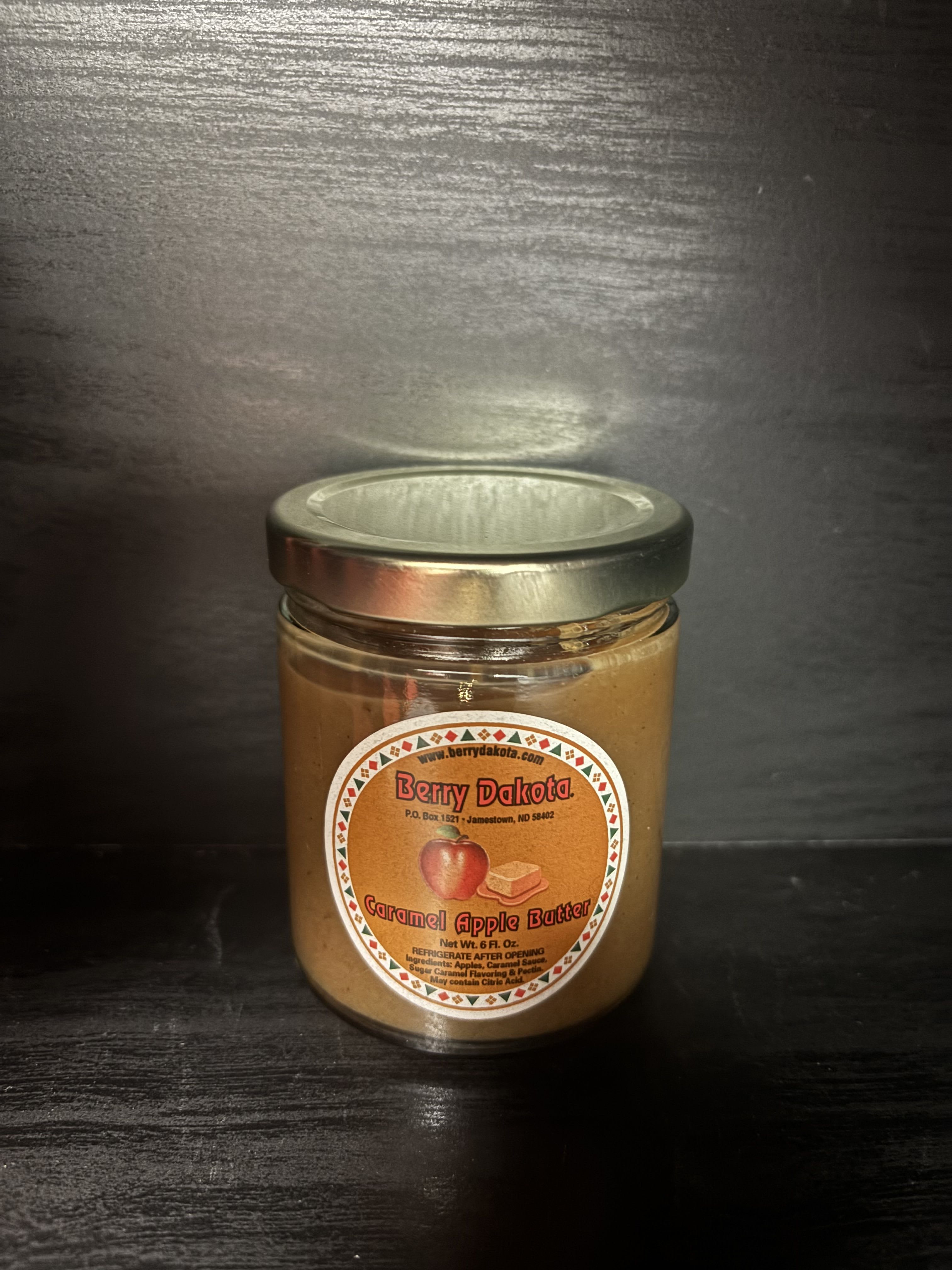 Jar of caramel apple butter with a metal lid
