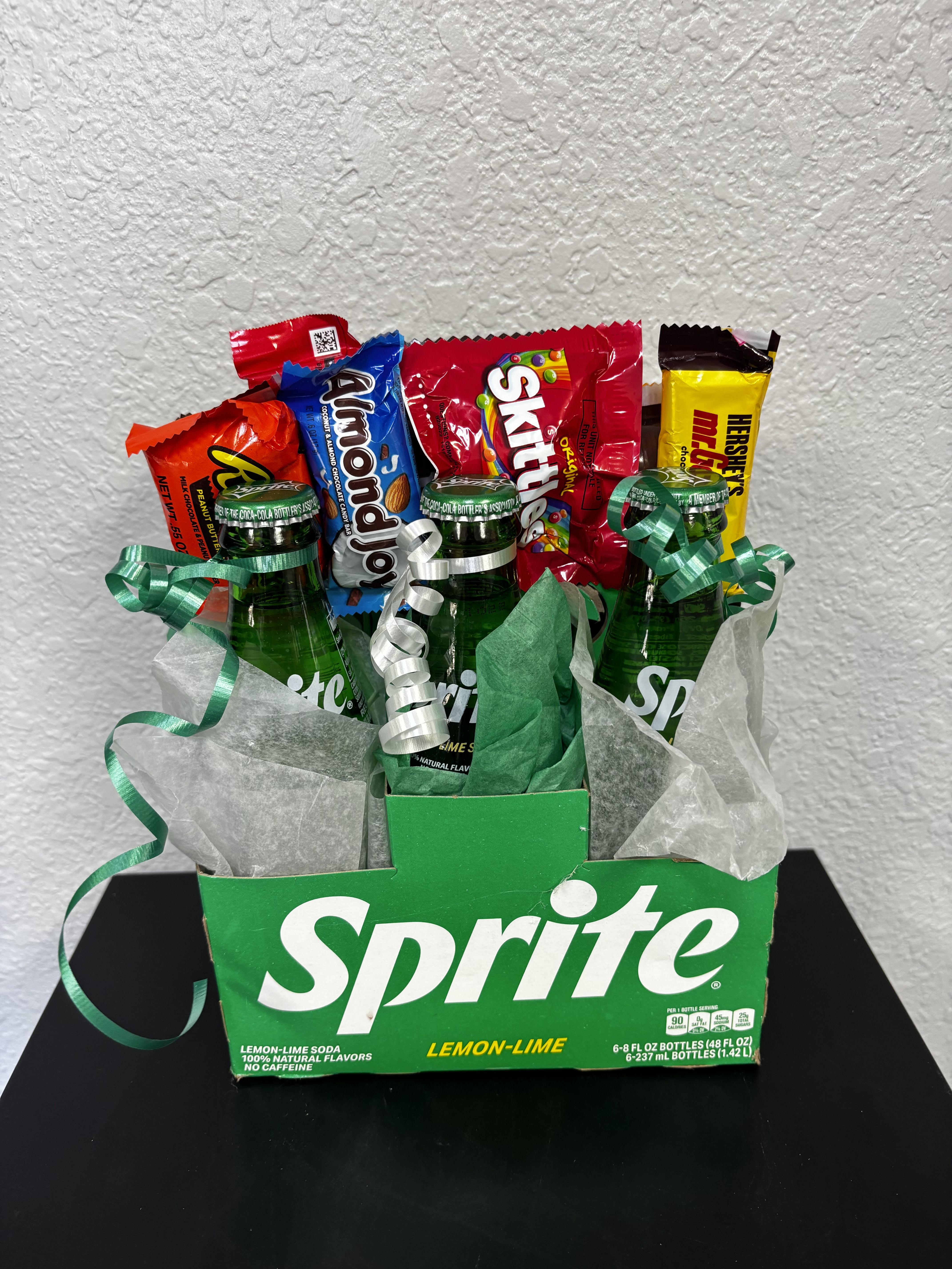 Gift basket with Sprite bottles and assorted candy bars