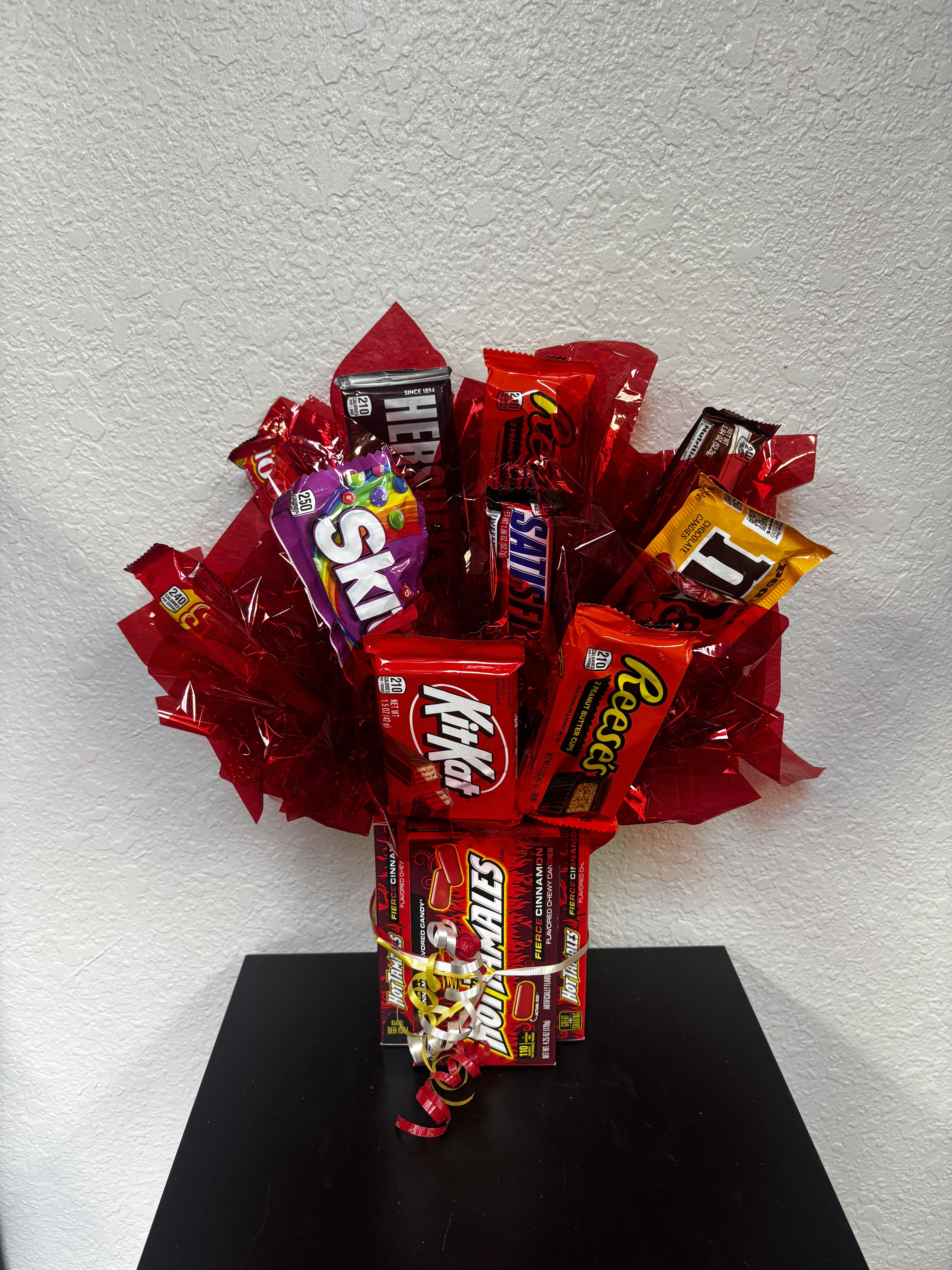 Candy bouquet with assorted chocolate bars wrapped in red cellophane