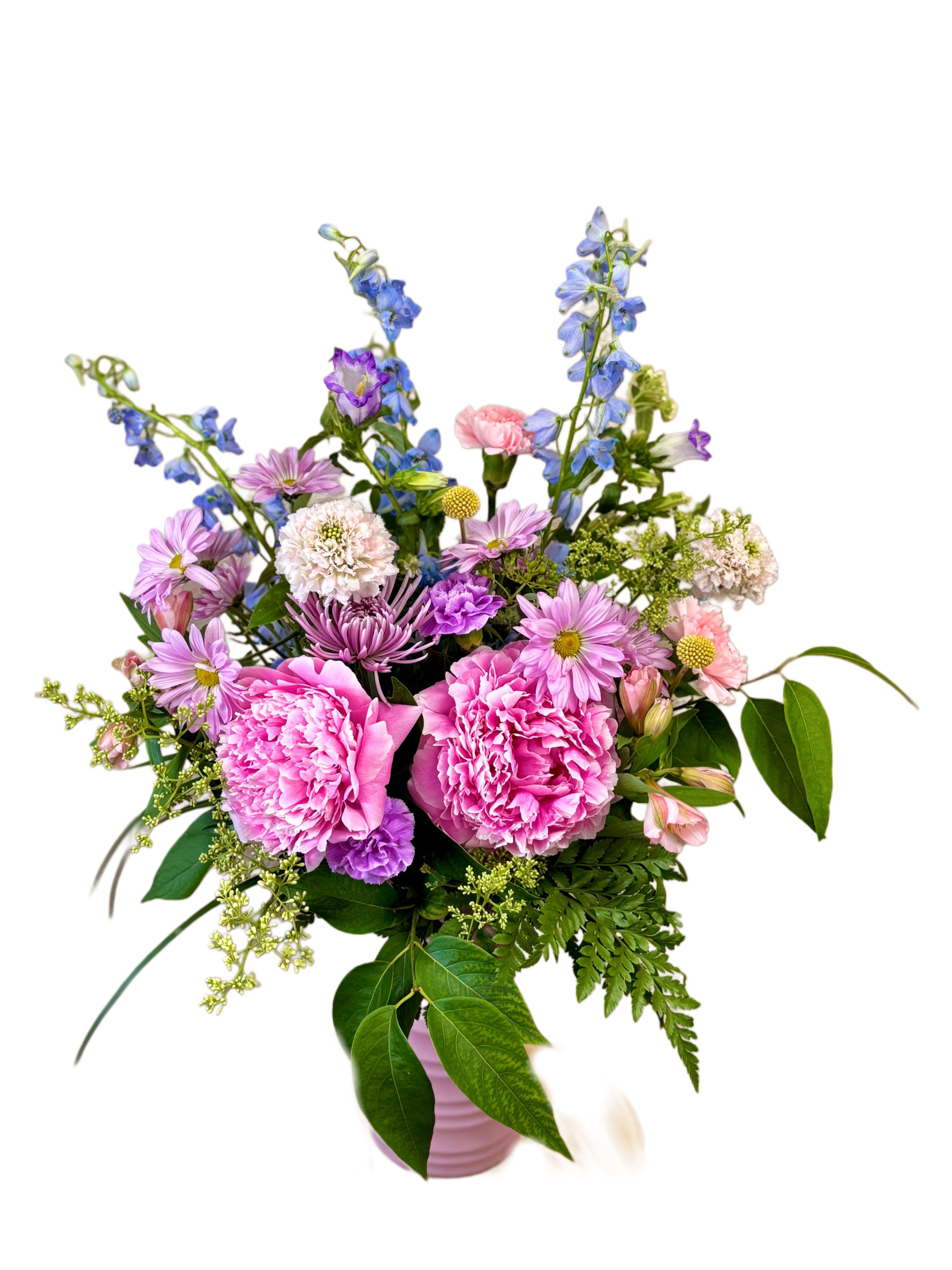 Pink and purple mixed bouquet in a pink vase