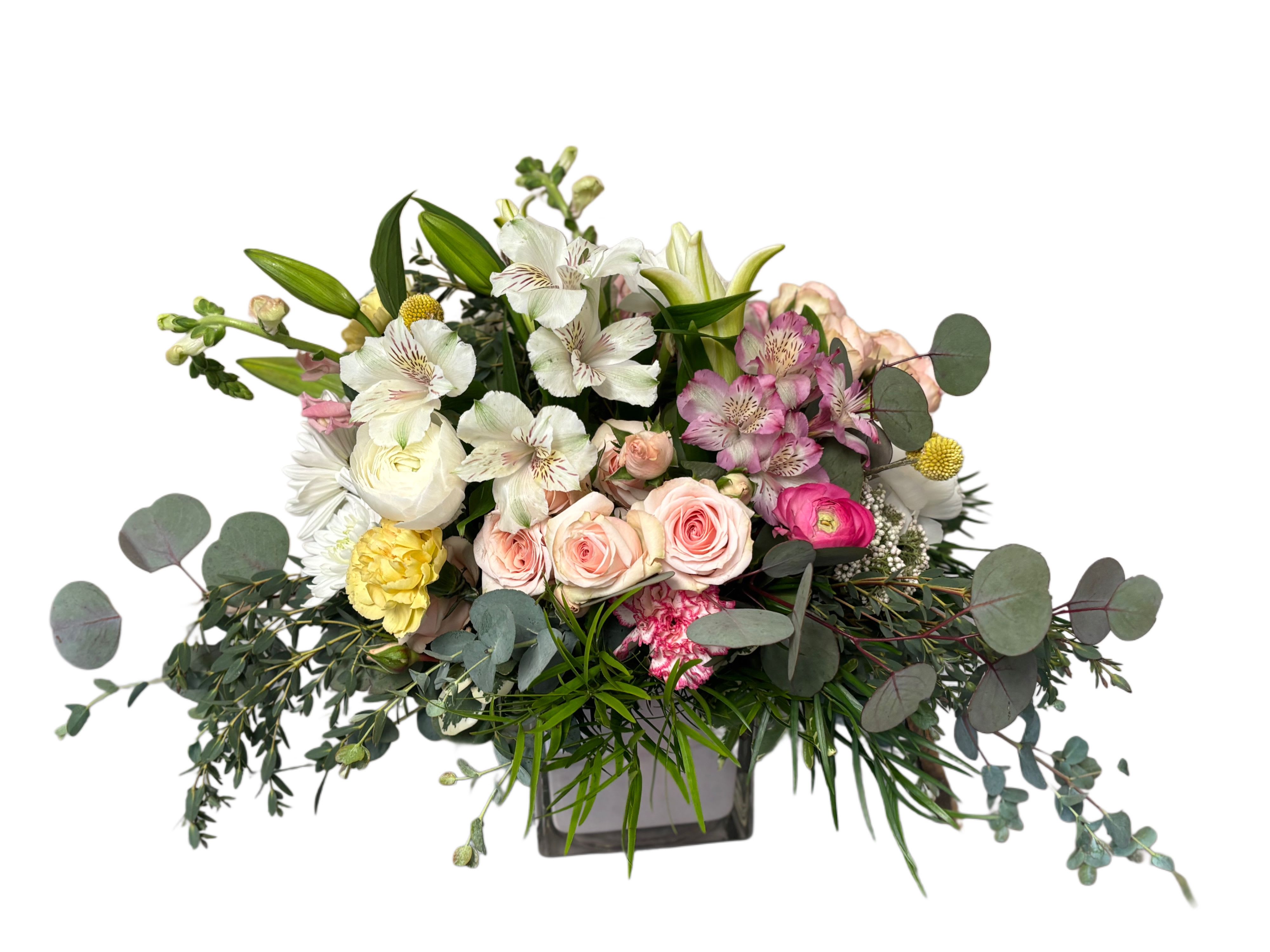 Mixed bouquet of roses, lilies, and alstroemeria in a square vase