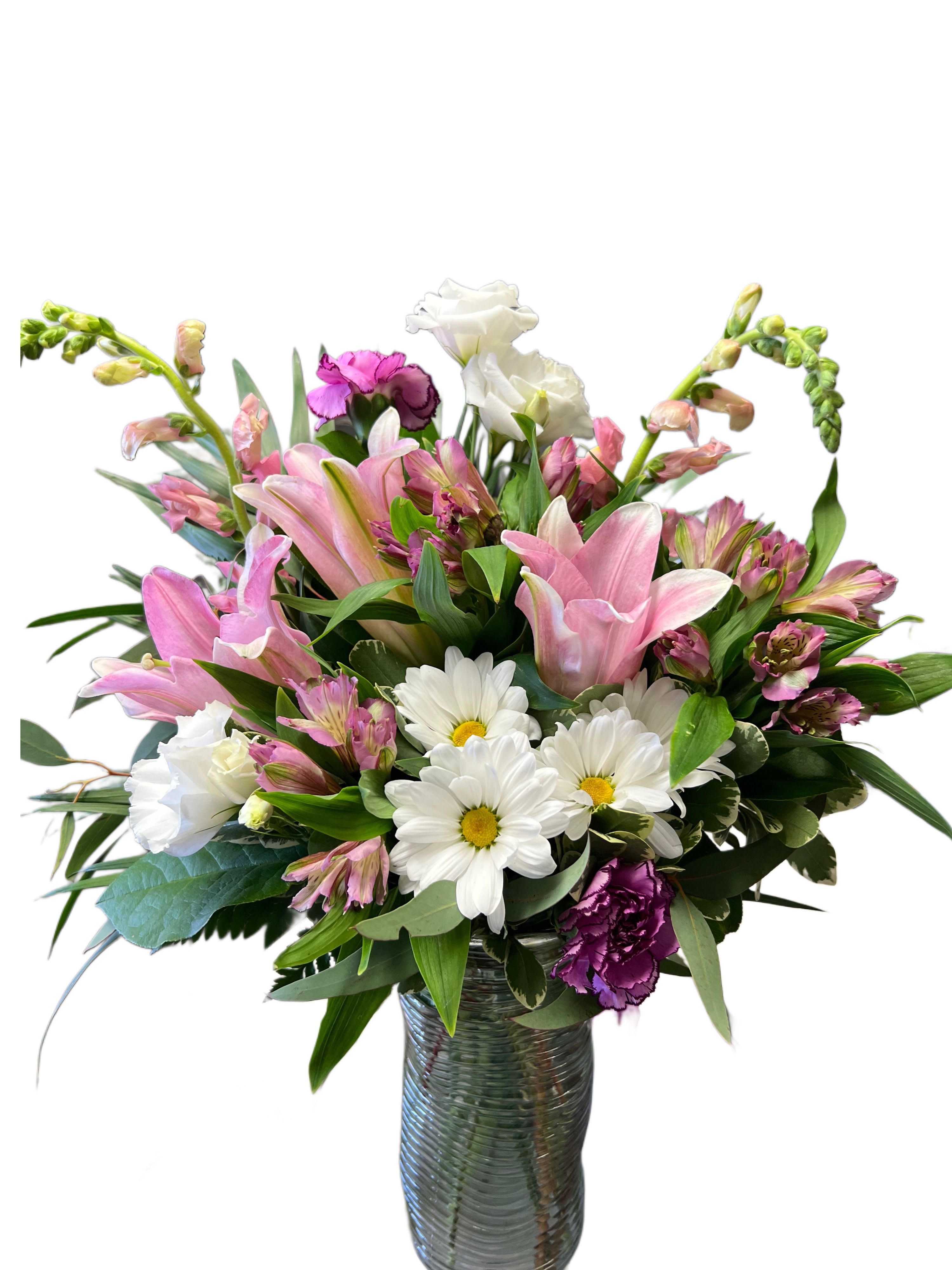 Pink lilies and white daisies in a glass vase
