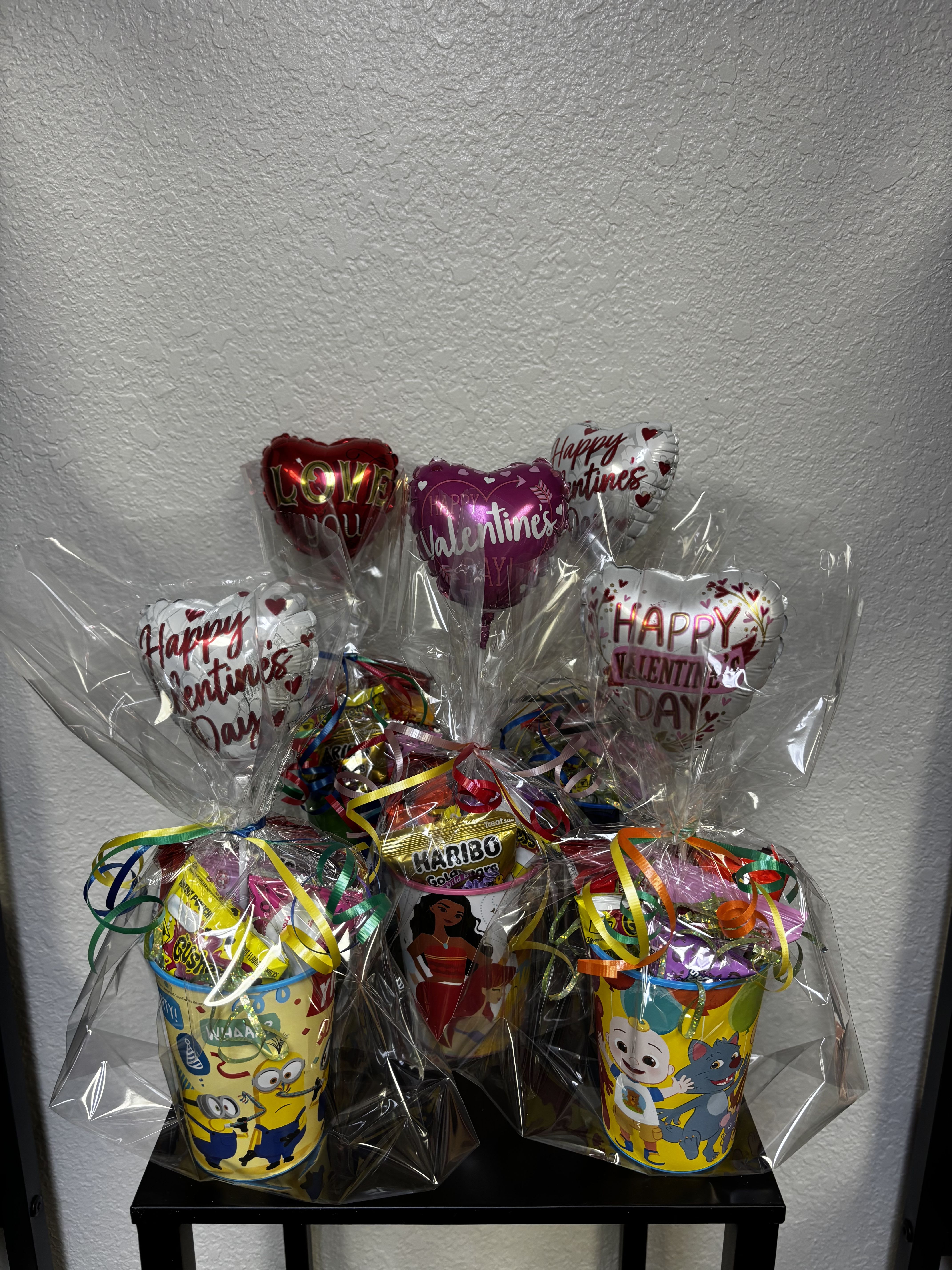Valentine's Day candy gift baskets with heart balloons