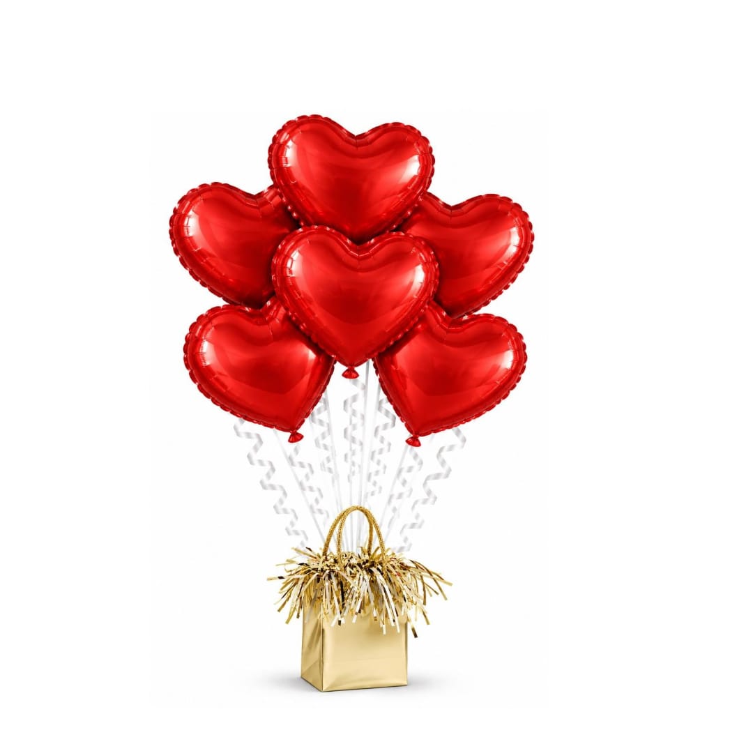 Five red heart-shaped balloons in a gold gift bag with curly ribbons