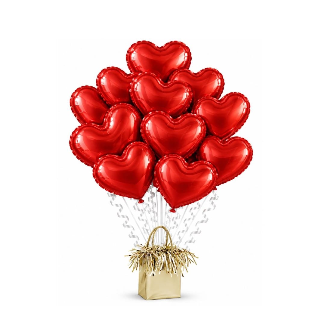 Cluster of red heart-shaped balloons in a gold gift bag