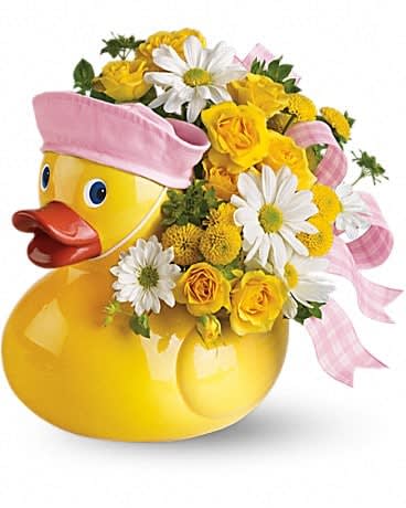 Yellow duck-shaped container with yellow and white flowers and pink ribbon