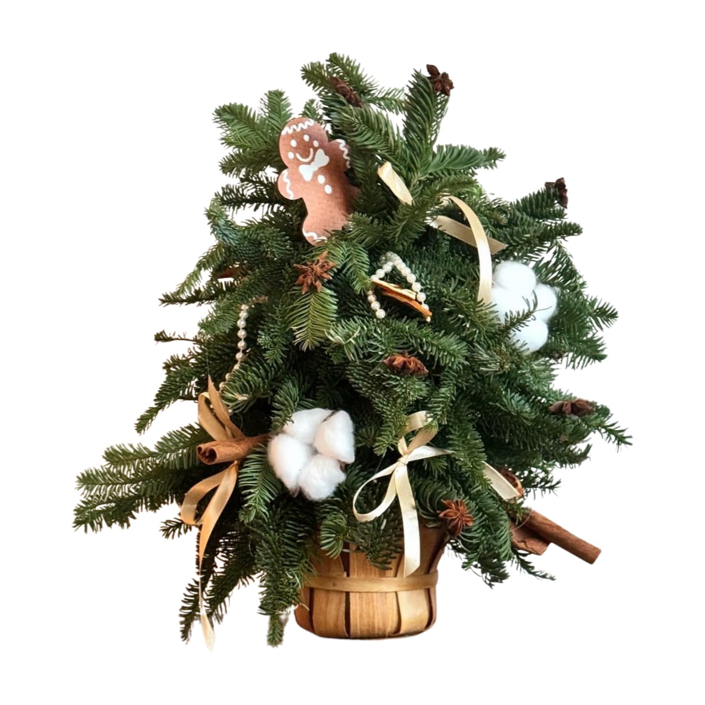 Ginger bread tree - A cozy Christmas tree without the needles on your floor   Fresh winter greenery styled into a mini tree in a wooden basket, decorated with cotton “snow”, dried orange slices, cinnamon sticks, star anise, pearl garlands, satin bows and a cute gingerbread cookie topper.  Perfect for an entryway, coffee table or office desk, and makes an amazing hostess gift. Designer’s choice: décor pieces may slightly vary, but the warm, neutral holiday vibe stays the same.