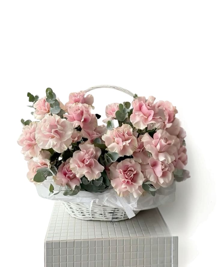 Blushing Rose Basket - A romantic blush rose basket overflowing with soft pink blooms and fresh eucalyptus, designed to feel airy, elegant, and super giftable. Perfect for birthdays, baby showers, anniversaries, or “thinking of you” moments. Arranged in a white keepsake basket for an effortless, luxe look.  Includes: blush roses/spray roses + premium greenery in a white basket