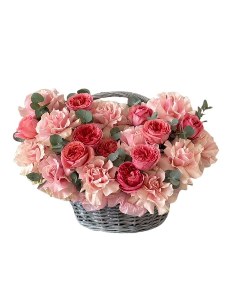 Strawberry Cream Basket - A lush, garden-style flower basket in layered shades of soft blush + deep rose pink, finished with touches of eucalyptus for a fresh, modern feel. Full, romantic, and super giftable — perfect for birthdays, anniversaries, new baby celebrations, or a “just because” moment.  Includes: premium seasonal blooms (garden roses/roses + soft ruffled blooms) and greenery in a keepsake basket. Note: Flower varieties may vary slightly based on availability, but we always keep the same pink color story and full, fluffy look.