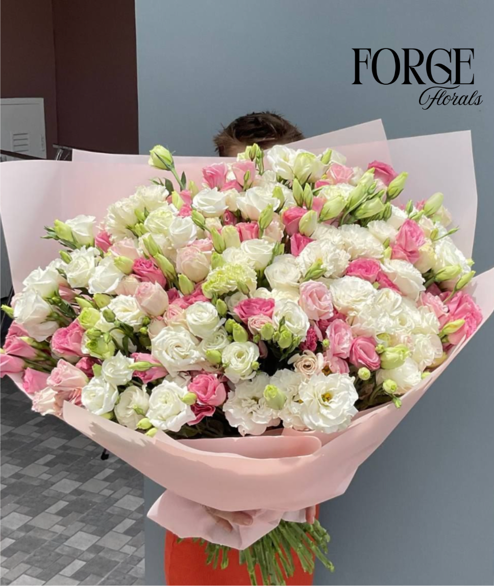 Pink Whisper - A cloud of soft pink and creamy white blooms that feels like a warm hug. Delicate, airy, and wildly romantic this bouquet is made for big feelings, gentle hearts, and “I’m thinking of you” moments. Perfect for birthdays, anniversaries, or just because.