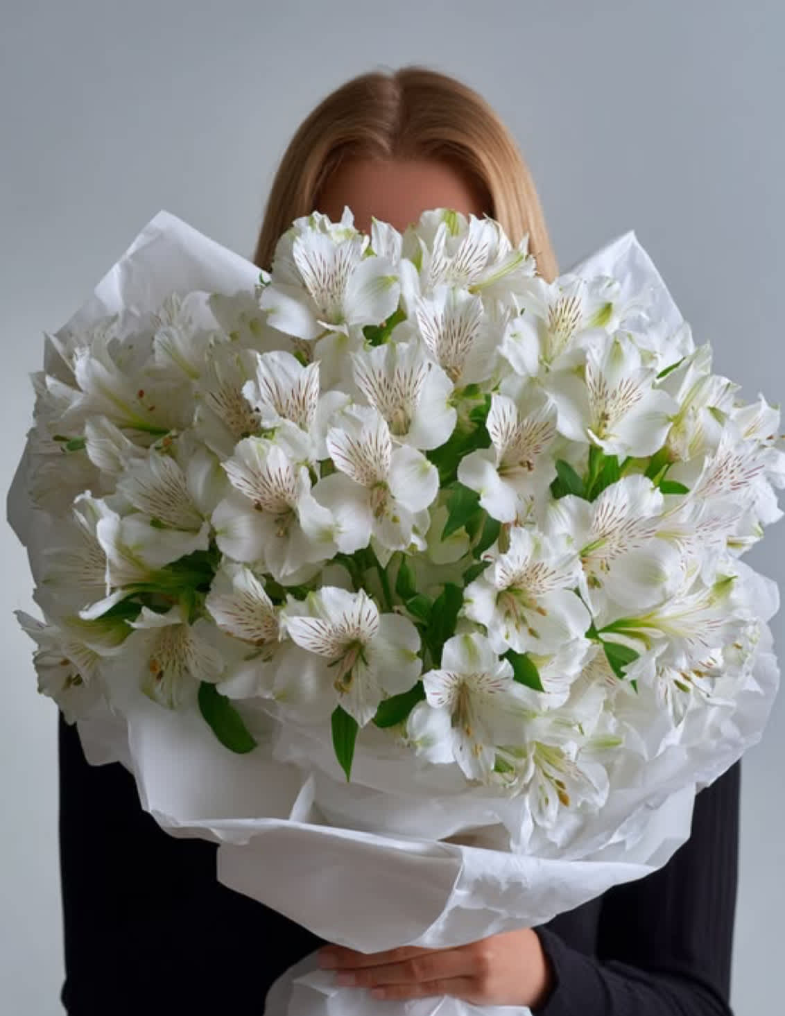 Large bouquet of white alstroemeria wrapped in white paper