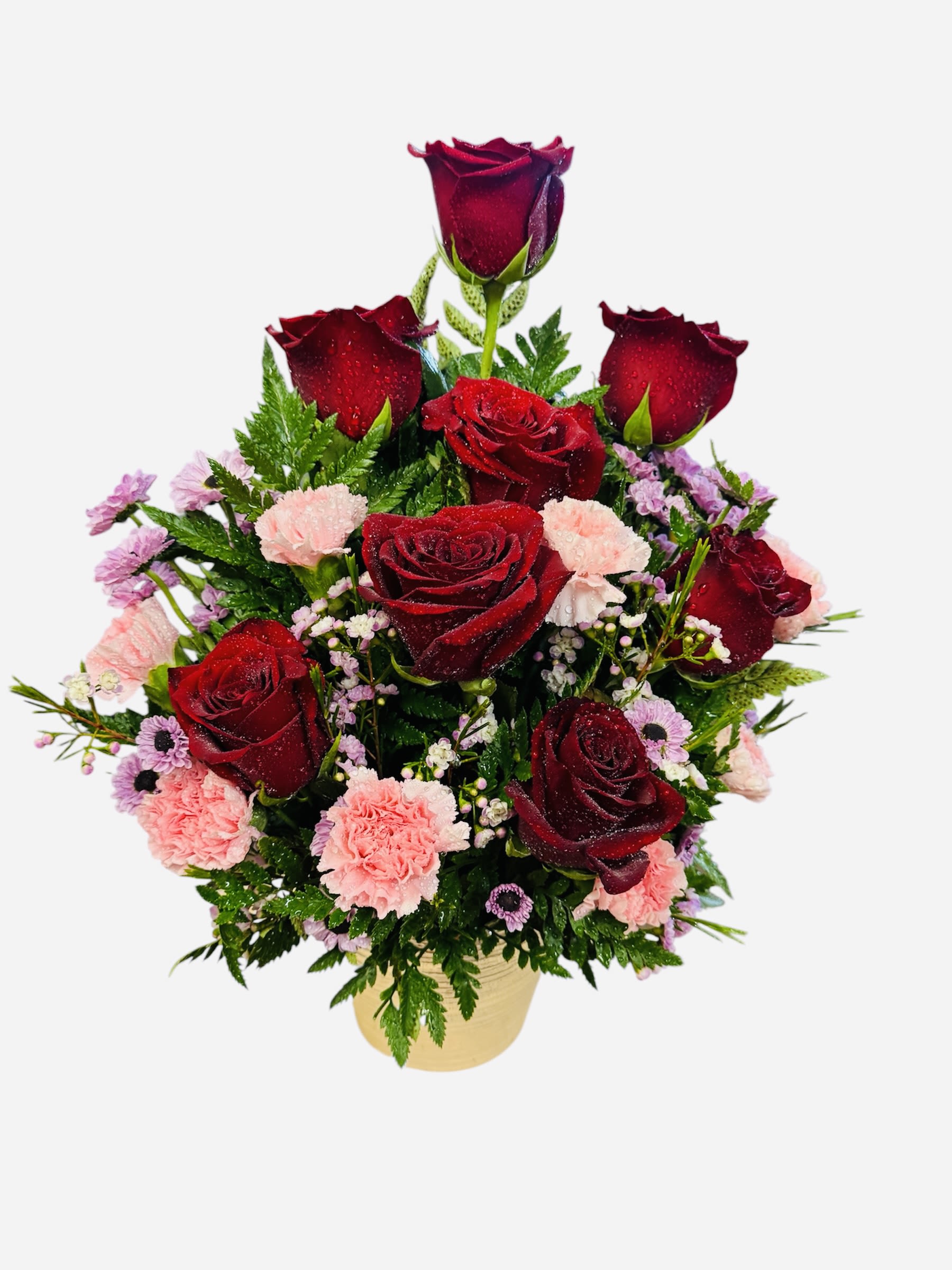 Red roses and pink carnations in a gold vase