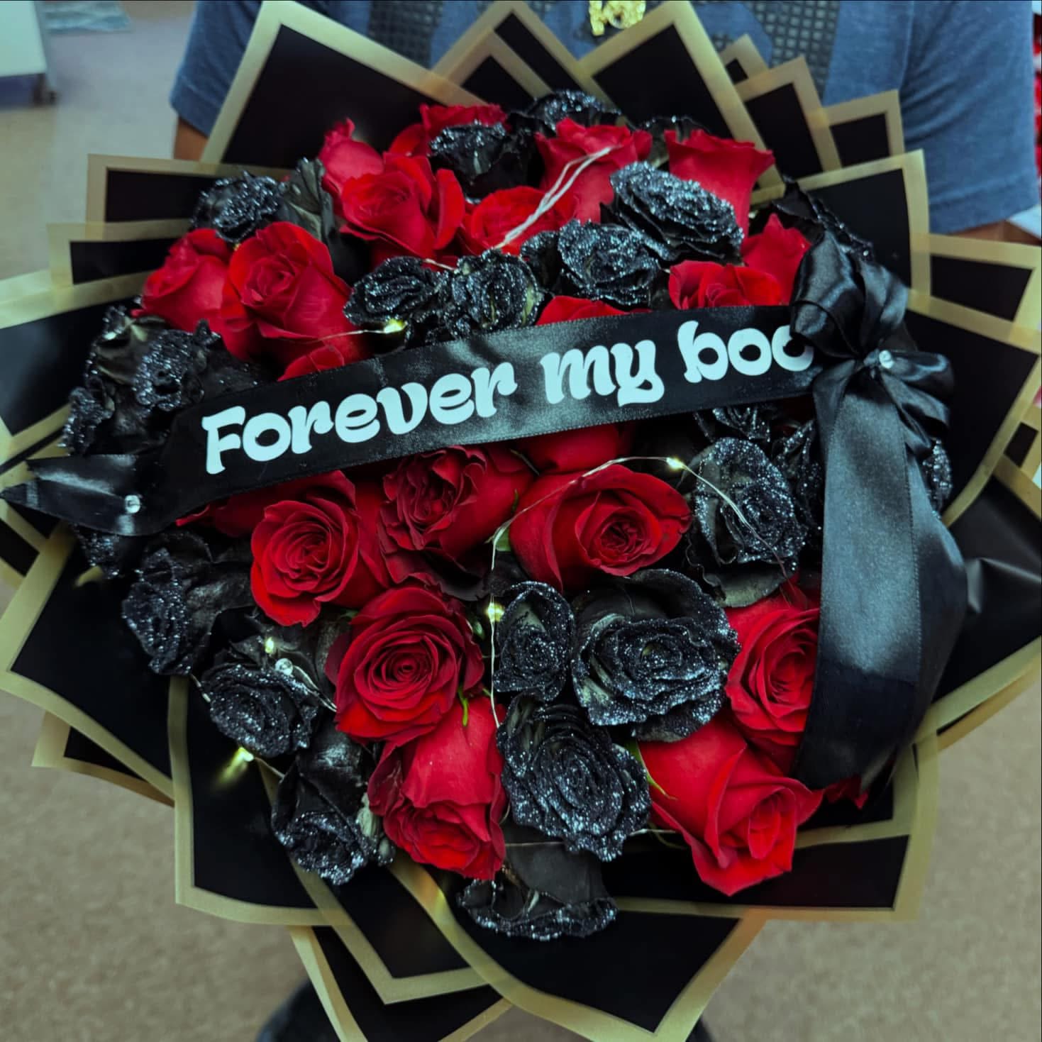 Bouquet of red roses with black glitter roses and a ribbon