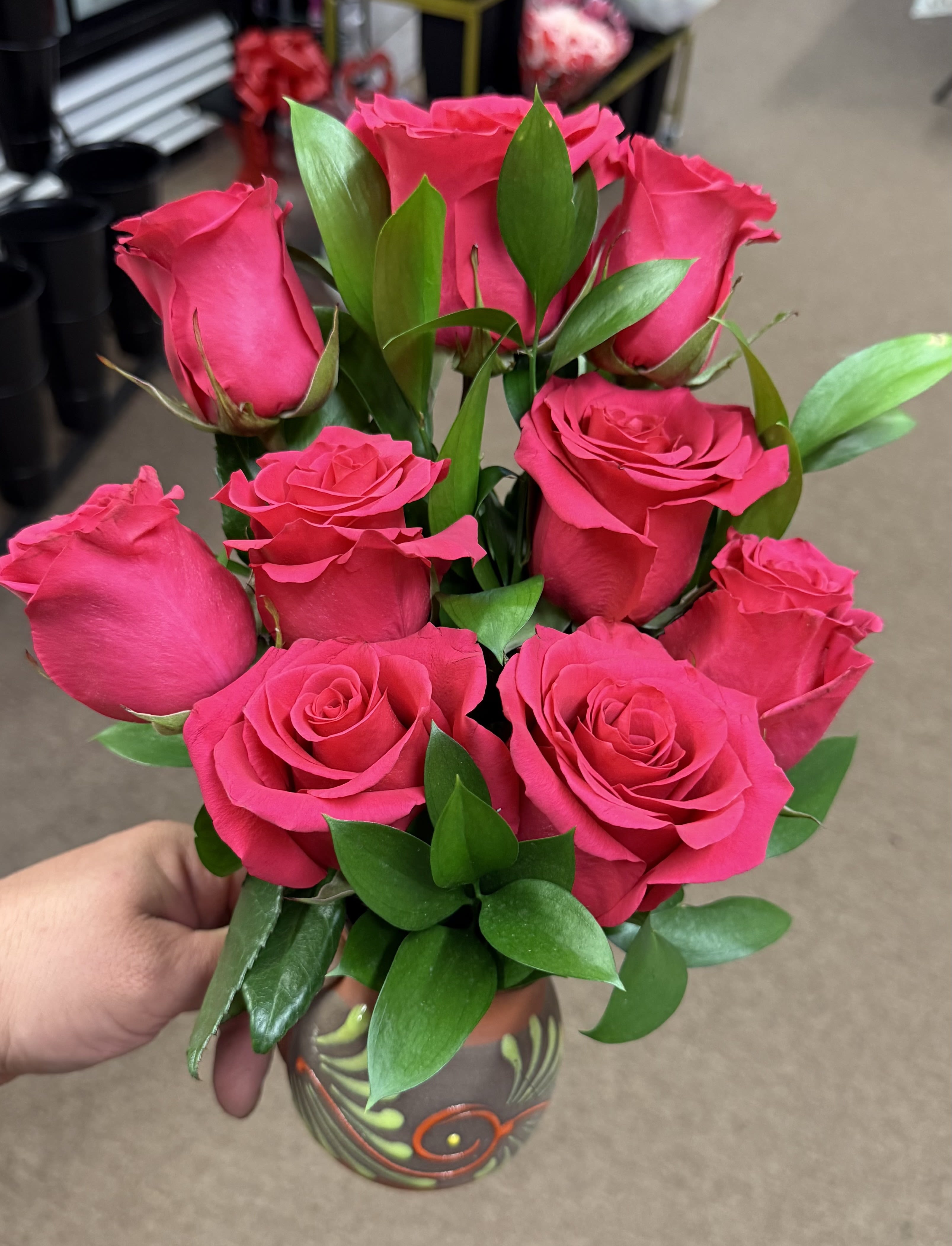 Bouquet of hot pink roses in a decorative vase