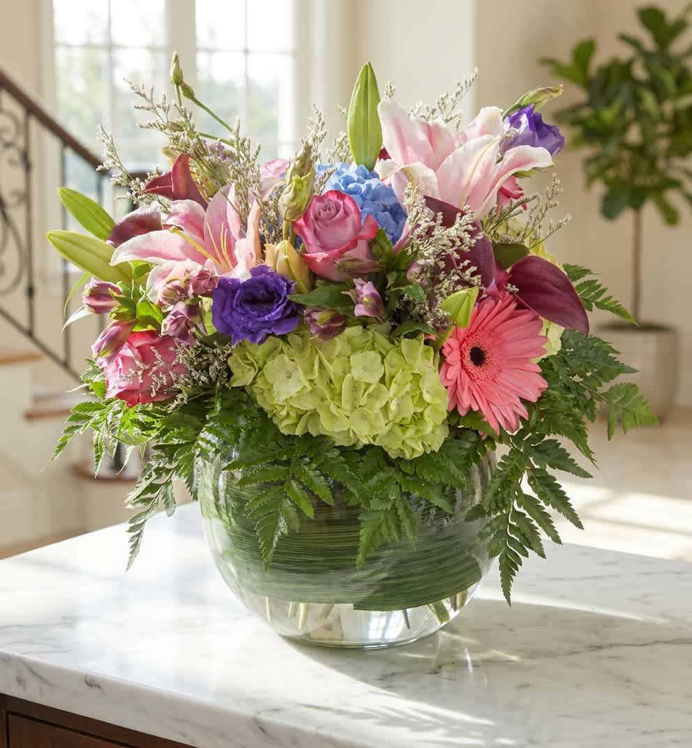 Vivid dream (DL) - Bright pink and lavender blooms make an immediate, joyful impression-Vivid dream is a garden-style flower arrangement built to make her feel celebrated. This birthday bouquet (also perfect for thank-you gifts or spring celebrations) pairs fragrant pink and white lilies with blush roses and a single pink gerbera daisy for a playful focal point, while a cluster of blue hydrangea and fresh green, fern-like foliage soften the silhouette and add romantic depth. 
