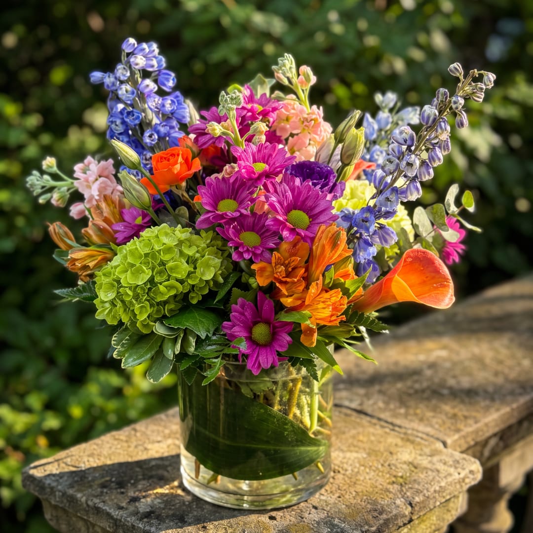 Colorful mixed bouquet in a clear glass vase