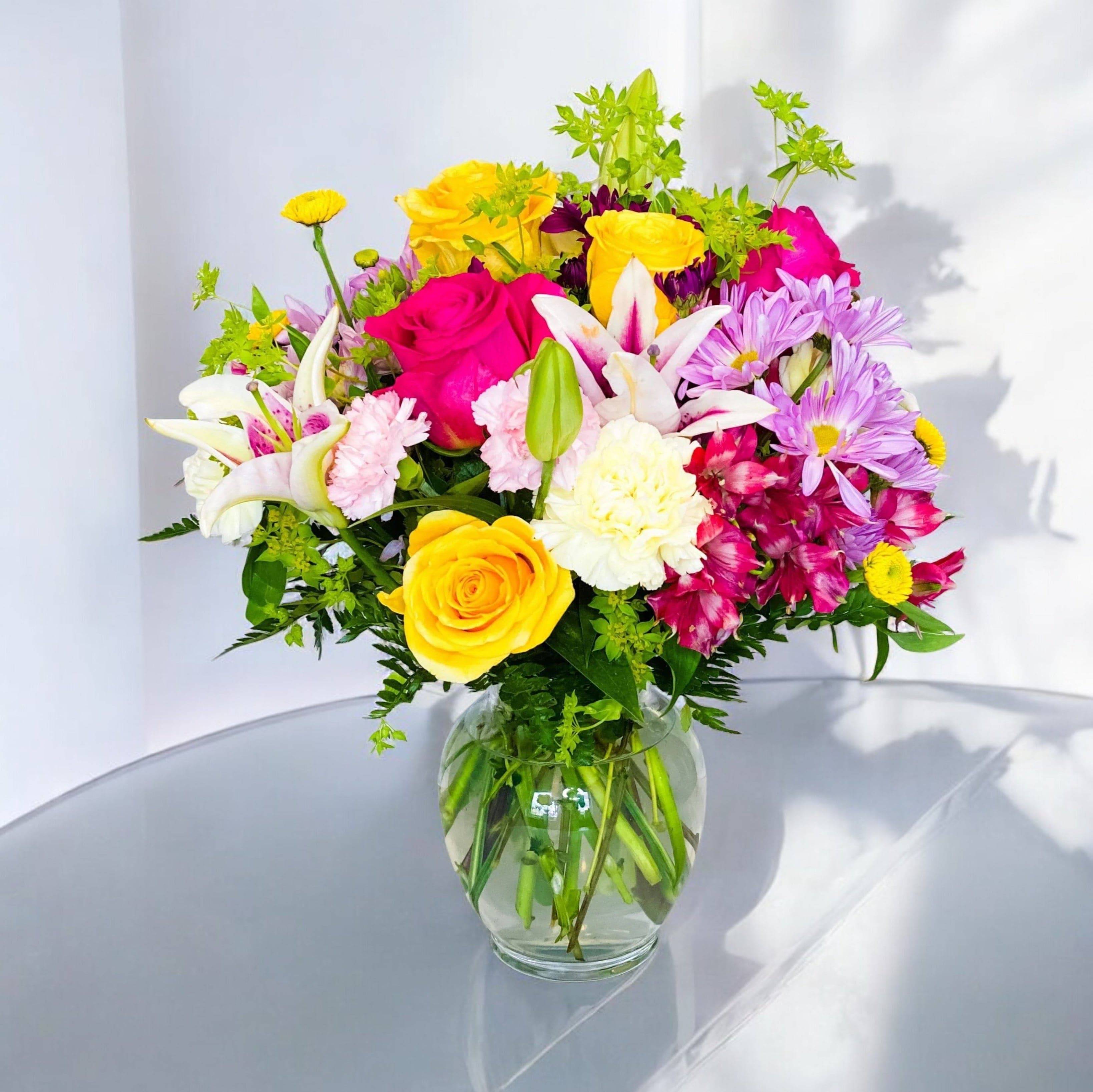 Colorful mixed bouquet in a clear glass vase