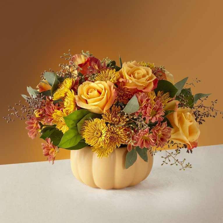 Pumpkin Spice Forever Bouquet - Why wait to indulge in your favorite fall flavors once a year? Let the Pumpkin Spice Forever bouquet bring a delicious touch of fun to your space. The warmed–tone roses and accented pompon stems are better admired around a dinner table.   --   Why wait to indulge in your favorite fall flavors once a year? Let the Pumpkin Spice Forever bouquet bring a delicious touch of fun to your space. The warmed–tone roses and accented pompon stems are better admired around a dinner table.