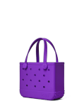 Bogg Bag Bitty - Houston We Have A Purple - Small but mighty. The Bitty Bogg Bag is our most compact tote—perfect for kids, snacks, small essentials, or even as a stylish lunch tote. It’s tip-proof, durable, and fully washable—just like our larger bags, but in a mini size made for quick trips and light hauls.  Great for Mommy &amp; Me moments or anyone who loves a grab-and-go option with serious charm.  Includes a small clear pouch for storing little essentials like keys, lip balm, or hand sanitizer.  Best for: Kids, lunches, snacks, small items, quick errands.