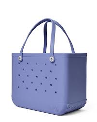 Bogg Bag Original - Periwinkle - The bag that started it all—washable, indestructible, and built to carry it all. The Original Bogg Bag is our largest, most spacious tote—perfect for beach days, big hauls, and everyday family adventures.  Durable and tip-proof, it stands upright, wipes clean, and keeps up with whatever your day throws at it. Sand brushes off. Spills don’t stick.  Includes two clear insert bags—perfect for organizing smaller essentials like your phone, sunscreen, keys, or snacks.  Pair it with our full line of Bogg accessories—dividers, toppers, coolers, makeup bags, and more—to build your ultimate carryall kit.  Best for: Beach trips, travel days, family outings, and everything in between.