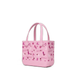 Bogg Bag Bitty - Bogg n' Boots - Small but mighty. The Bitty Bogg Bag is our most compact tote—perfect for kids, snacks, small essentials, or even as a stylish lunch tote. It’s tip-proof, durable, and fully washable—just like our larger bags, but in a mini size made for quick trips and light hauls.  Great for Mommy &amp; Me moments or anyone who loves a grab-and-go option with serious charm.  Includes a small clear pouch for storing little essentials like keys, lip balm, or hand sanitizer.  Best for: Kids, lunches, snacks, small items, quick errands.