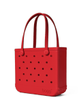 Red gift bag with black polka dots and arched handles