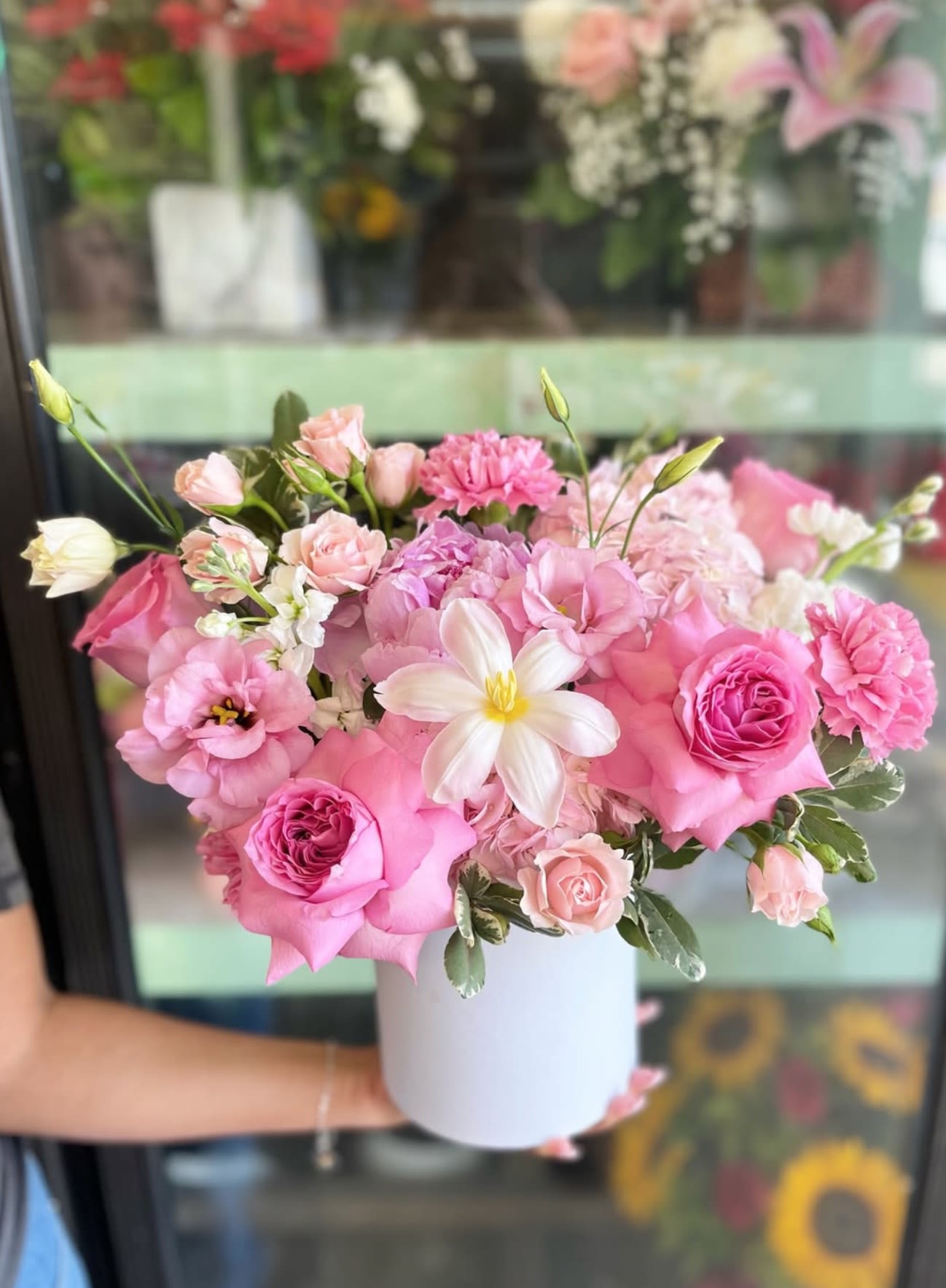 Pink and white bouquet in a white vase