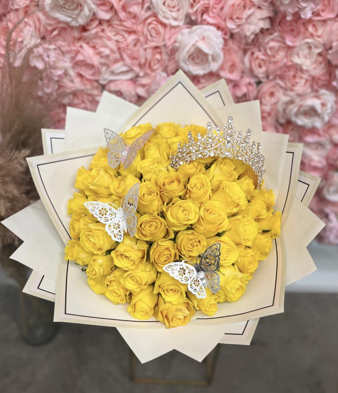 Yellow rose bouquet with butterfly picks and a jeweled tiara topper