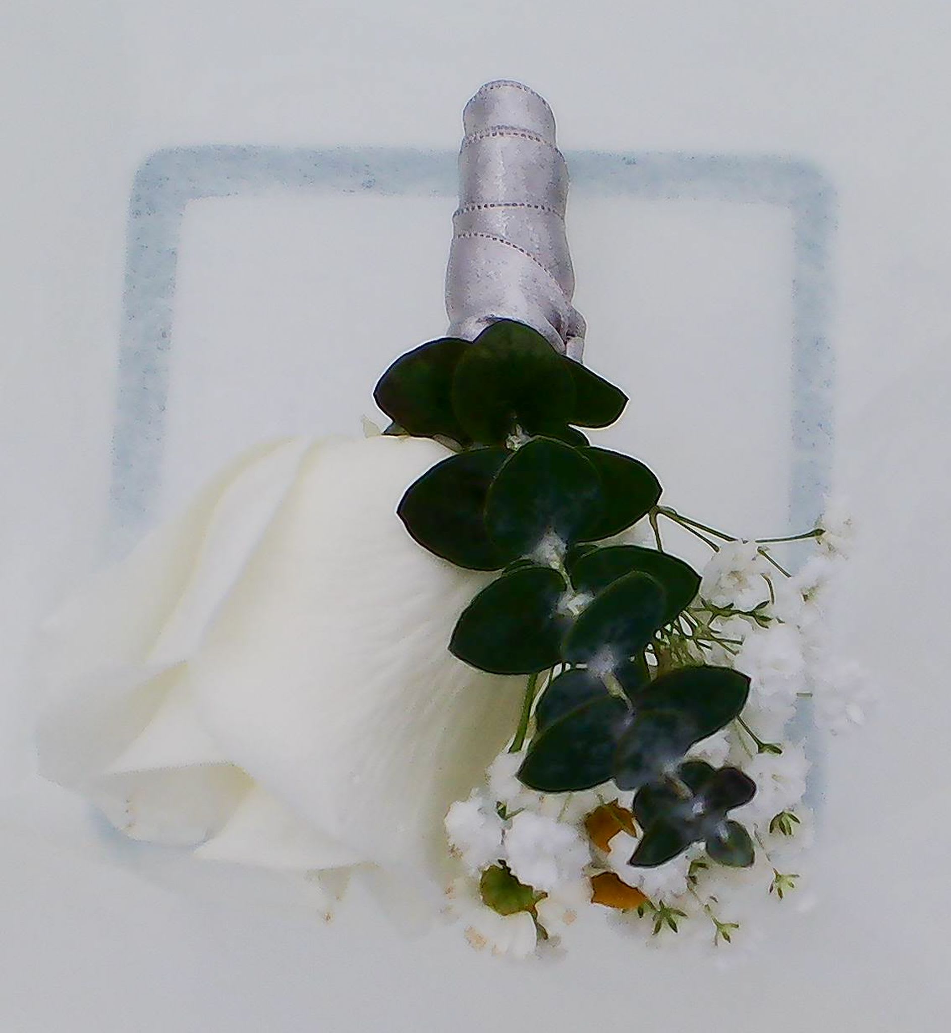 Classic Groom’s Wedding Boutonniere - This charming wedding boutonniere features a pristine white rose, accented with fresh greenery and delicate white filler flowers, creating a timeless, refined look perfect for weddings, vow renewals, proms, or formal celebrations. Each boutonniere is prepared fresh on the day of delivery and delivered in a clear plastic box with two floral pins.