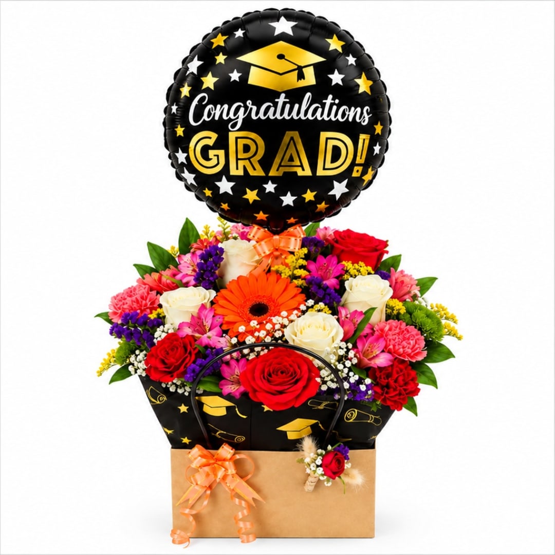 Graduation balloon above a mixed flower arrangement in a gift box