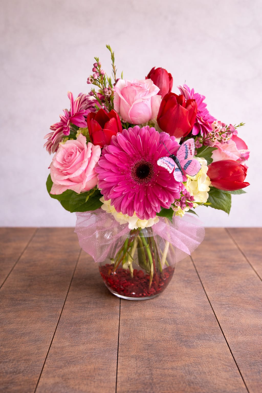 My Fair Lady – Roses, Tulips &amp; Gerbera Daisy Arrangement - Looking for a roses, tulips, and gerbera daisy arrangement in Round Rock, TX? My Fair Lady by Floral Fabulous features a vibrant mix of premium blooms with same-day delivery available. Perfect for birthdays, anniversaries, or just because, this colorful arrangement is designed by your trusted local florist on Mays Street in Round Rock and delivered throughout the Austin area. The My Fair Lady arrangement is a vibrant and elegant design featuring a beautiful blend of fresh roses, tulips, gerberas, and seasonal mixed flowers, artfully arranged in a clear glass vase with lush greenery. Full of color and texture, this arrangement creates a cheerful and refined presentation that brightens any space.  Perfect for birthdays, anniversaries, celebrations, or simply sending a thoughtful surprise, this design offers a lively mix of blooms that feel both fresh and timeless. At Floral Fabulous in Round Rock, TX, every arrangement is hand-crafted with premium flowers and attention to detail, ensuring a high-end look and long-lasting freshness.  We proudly offer same-day flower delivery in Round Rock, TX, and surrounding areas, making it easy to send a beautiful gift right when it matters most.   Roses, tulips, and seasonal mixed flowers  Bright, colorful, garden-style design  Arranged in a clear glass vase  Perfect for birthdays, celebrations, and everyday gifting  Same-day delivery available in Round Rock, TX