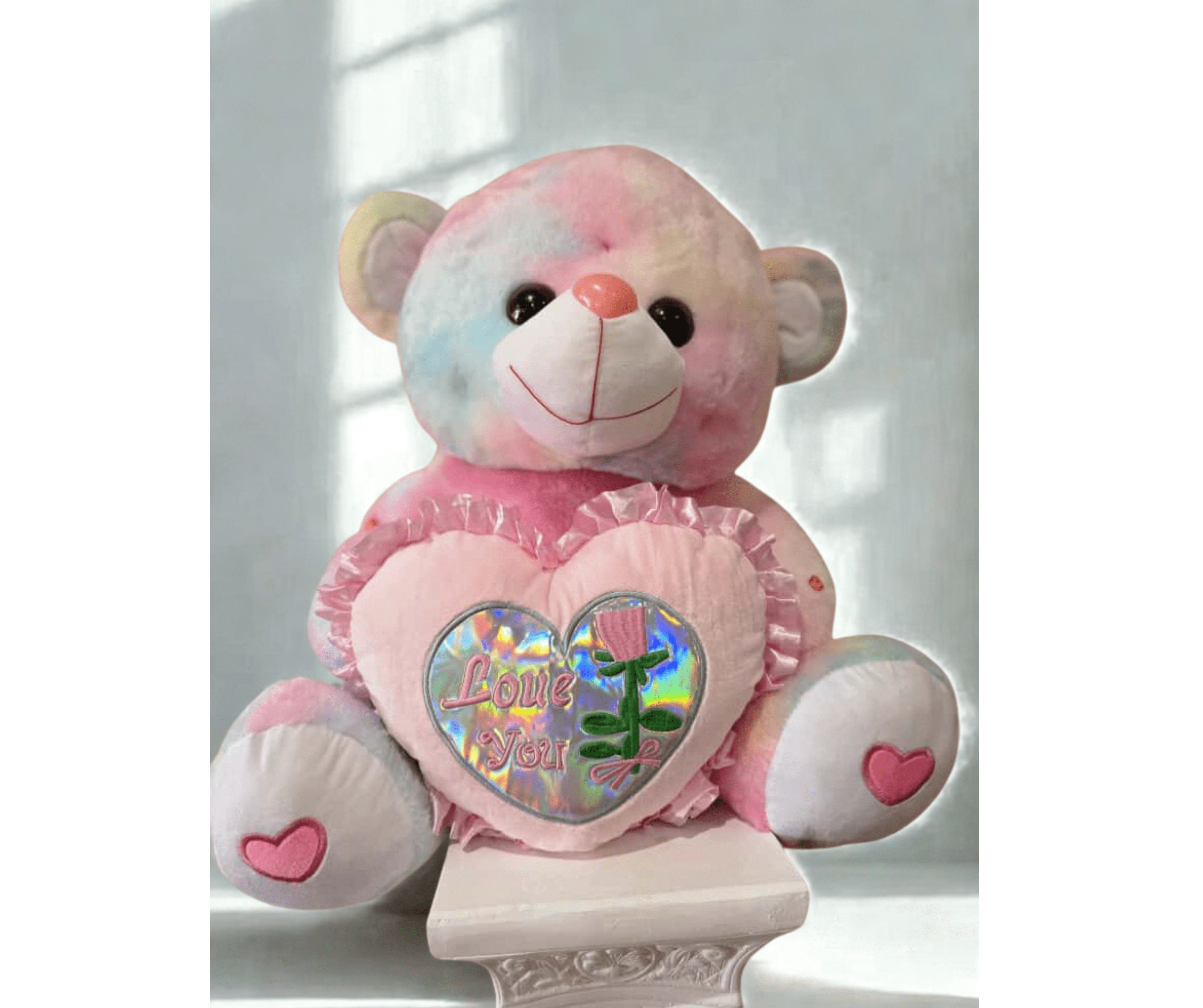Pastel teddy bear holding a heart with "Love You" text