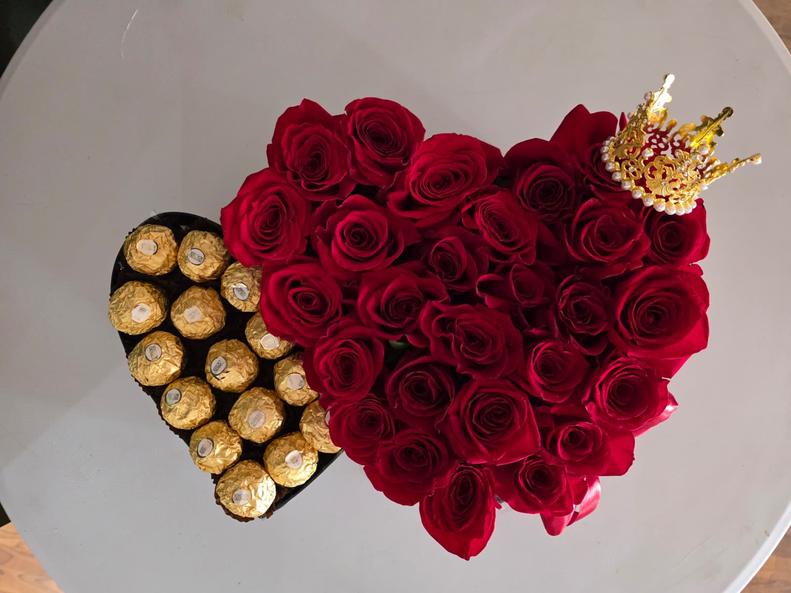 Heart-shaped rose arrangement with Ferrero Rocher chocolates and a small crown