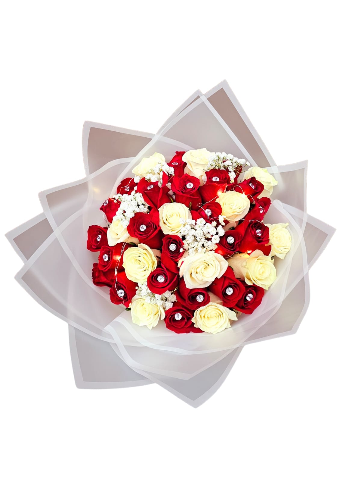 Bouquet of red and cream roses wrapped in translucent paper