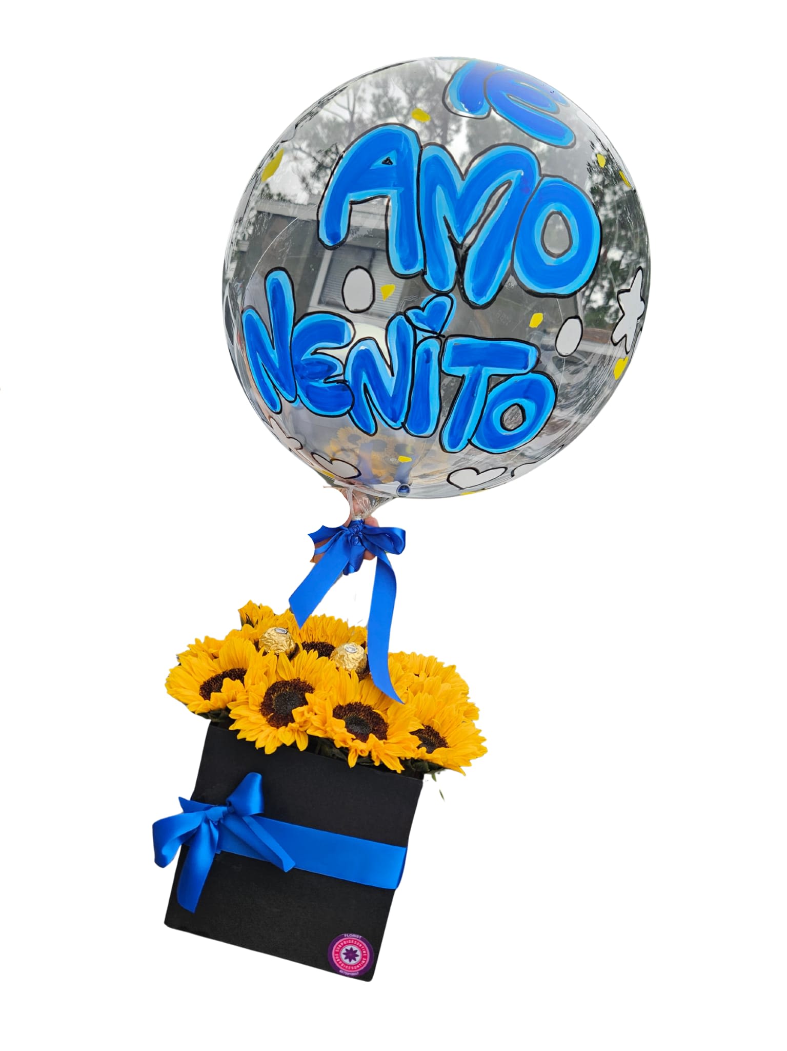Sunflower arrangement in a black box with a clear balloon reading "Amo Nenito"