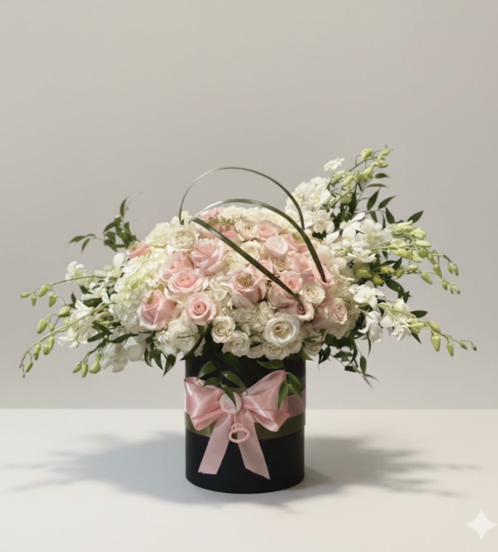 Welcome Baby Girl by Ritsa flowers  - A delicate and dreamy arrangement created to celebrate the arrival of a precious baby girl. Soft blush-pink roses mingle with pure white blooms, symbolizing love, innocence, and new beginnings. Designed with gentle textures and a feminine touch, this arrangement creates a beautiful moment of joy—perfect for welcoming a newborn, baby showers, or gifting to proud parents.