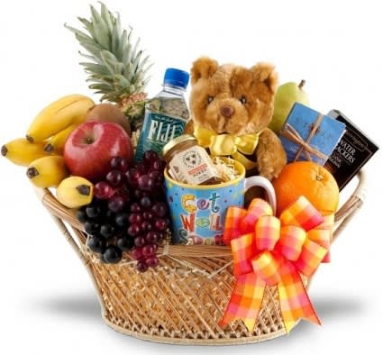 FEEL BETTER SOON FRUIT &amp; GOURMET BASKET - Even though that special someone may be under the weather, receiving this healthy and cheerful will certainly inspire a speedy recovery.A wicker basket is abundantly filled with classic get well treats, such as soothing tea, bottled, water, crackers, and cookies, as well as fresh fruits such as pineapple, oranges, apples, kiwi, pears, and grapes. A teddy bear or mug may be included in the basket where available.Food components and pictured items may vary to ensure the freshest basket possible. 