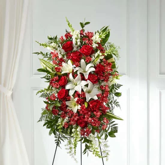 The Everlasting Memory Standing Spray - Our Everlasting Memory Standing Spray combines timeless hues with unique blooms to honor the life of the one you have lost. Each lily, rose and snapdragon are elegantly curated by our designers to share your messages of peace, sympathy and love