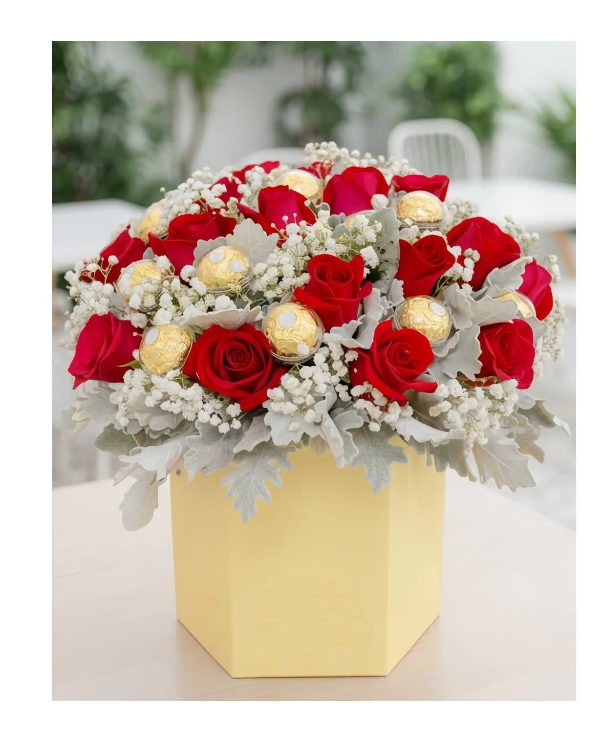 Red roses with gold chocolates in a yellow box