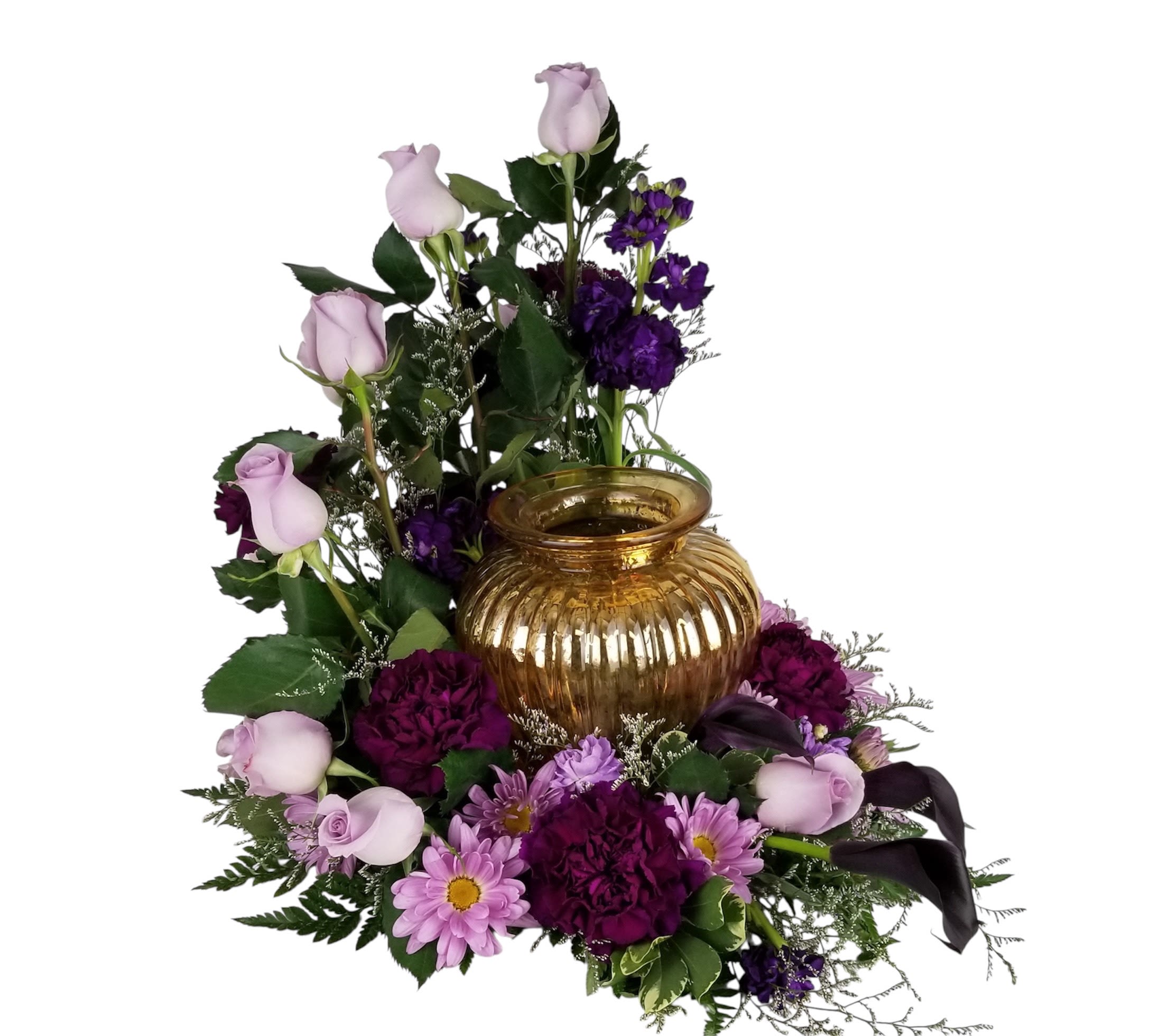Lavender and deep purple floral cremation arrangement surrounding a gold glass urn