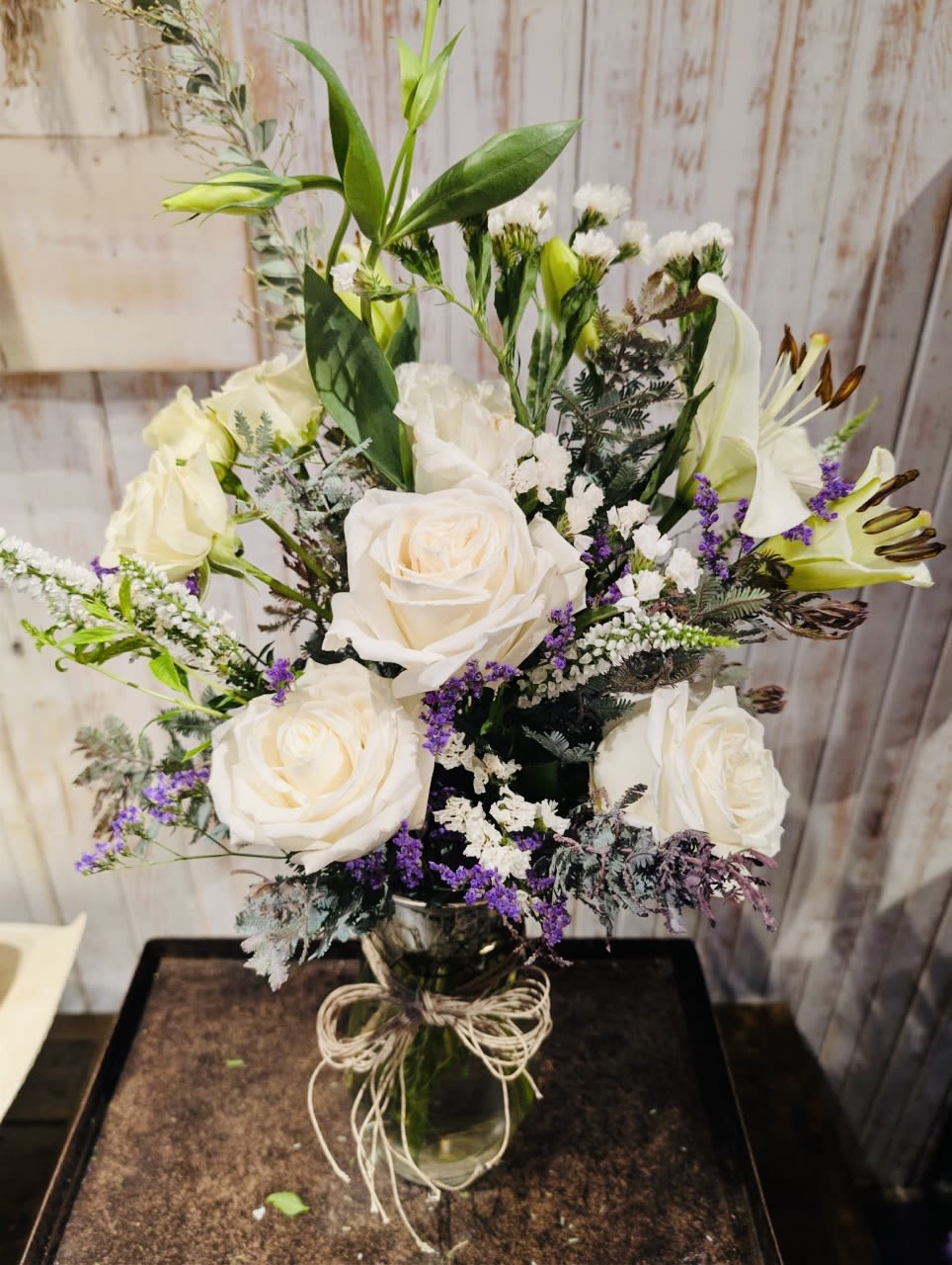 Touch of Purple - This arrangement is sure to please the eye and heart.   Roses, Lilies, beautiful Lisianthus and a touch of Limonium