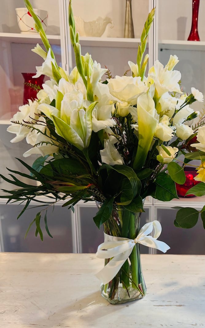 DESIGNER'S CHOICE - White Blooms (SEASONAL) - Our designer will create the perfect floral bouquet using the best of our white blooms. Perfect for all occasions, to brighten your loved ones day.    *SEASONAL - FLOWERS MAY VARY DUE TO AVAILABILITY