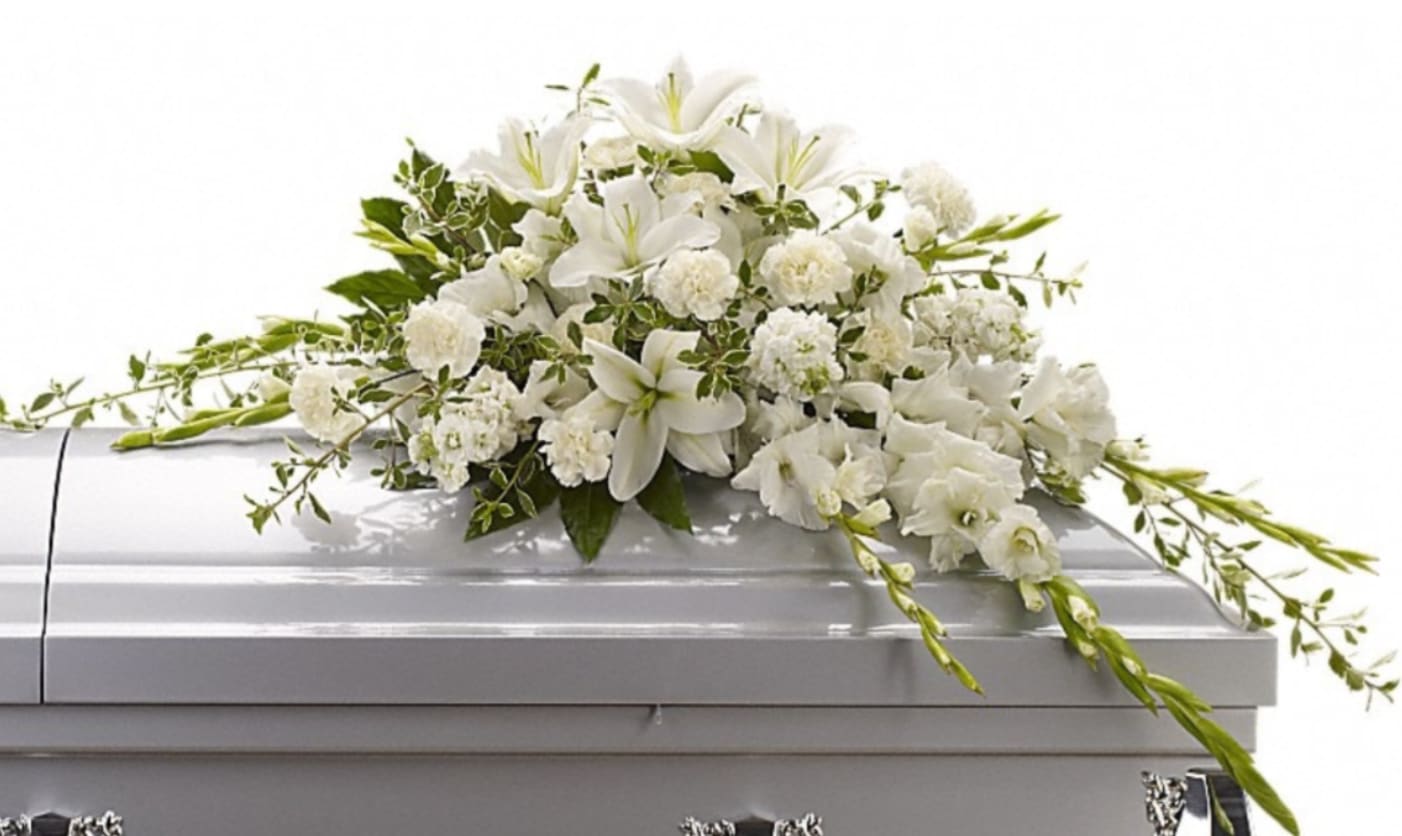 Peaceful Memories - Casket Spray - A timeless expression of honor, respect, and enduring remembrance.