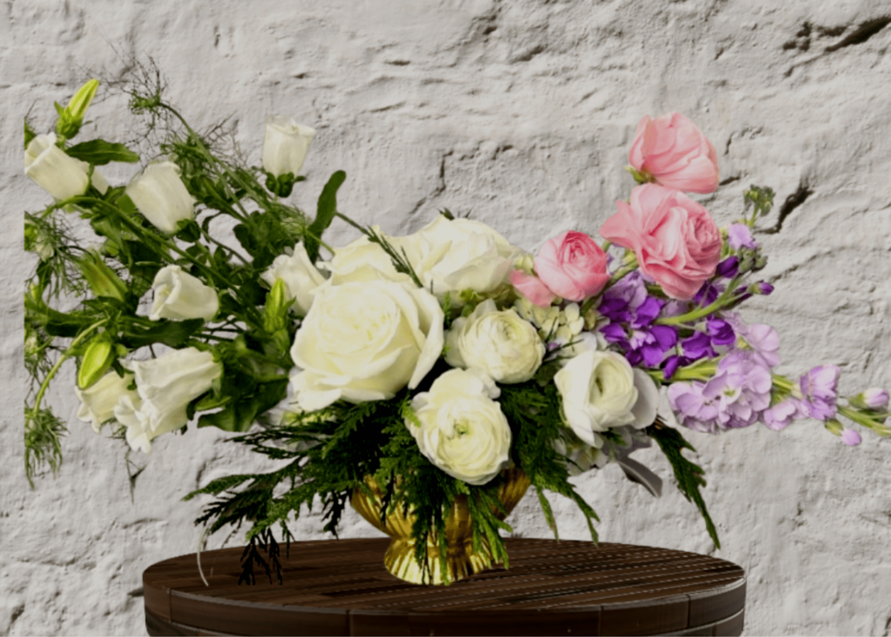Pink and white roses with purple flowers in a gold vase